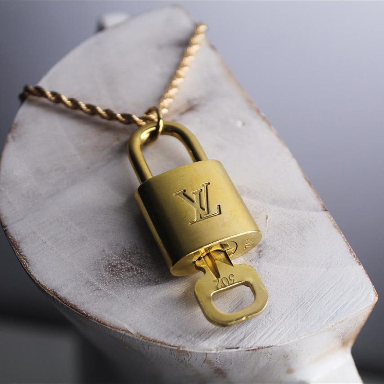 Authentic Louis Vuitton padlock with functioning... Depop