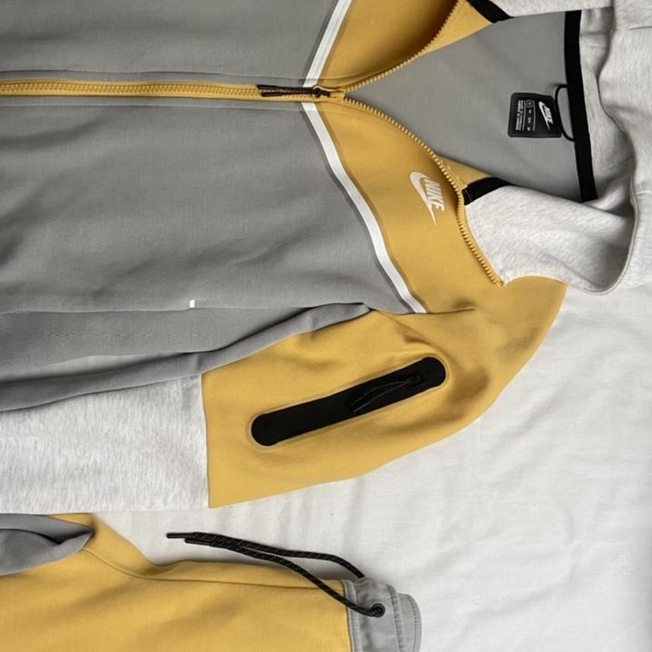 grey and yellow tech fleece