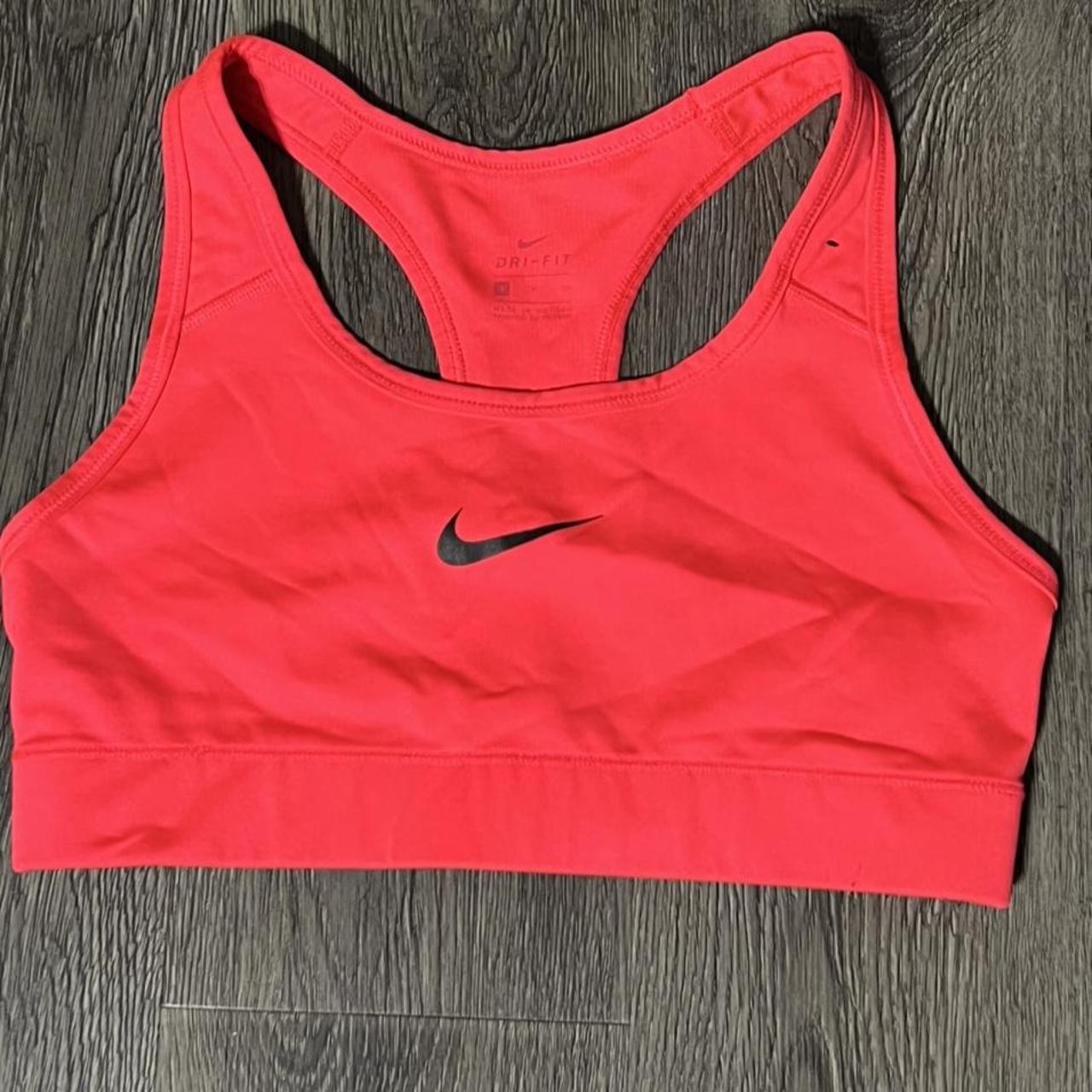 Hot Pink Nike sports bra. Size small but is on the - Depop