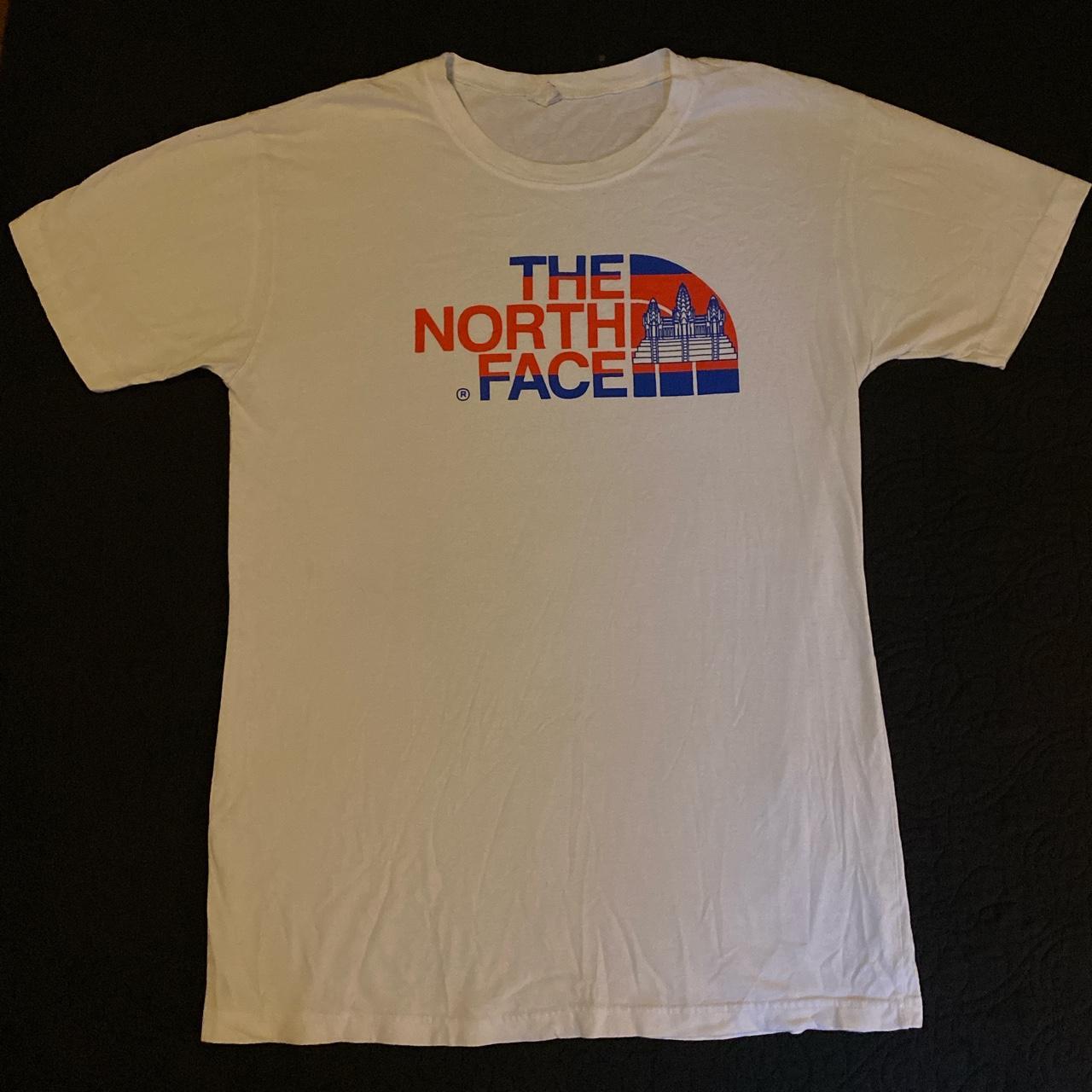The North Face designer white tshirt, size L.... Depop
