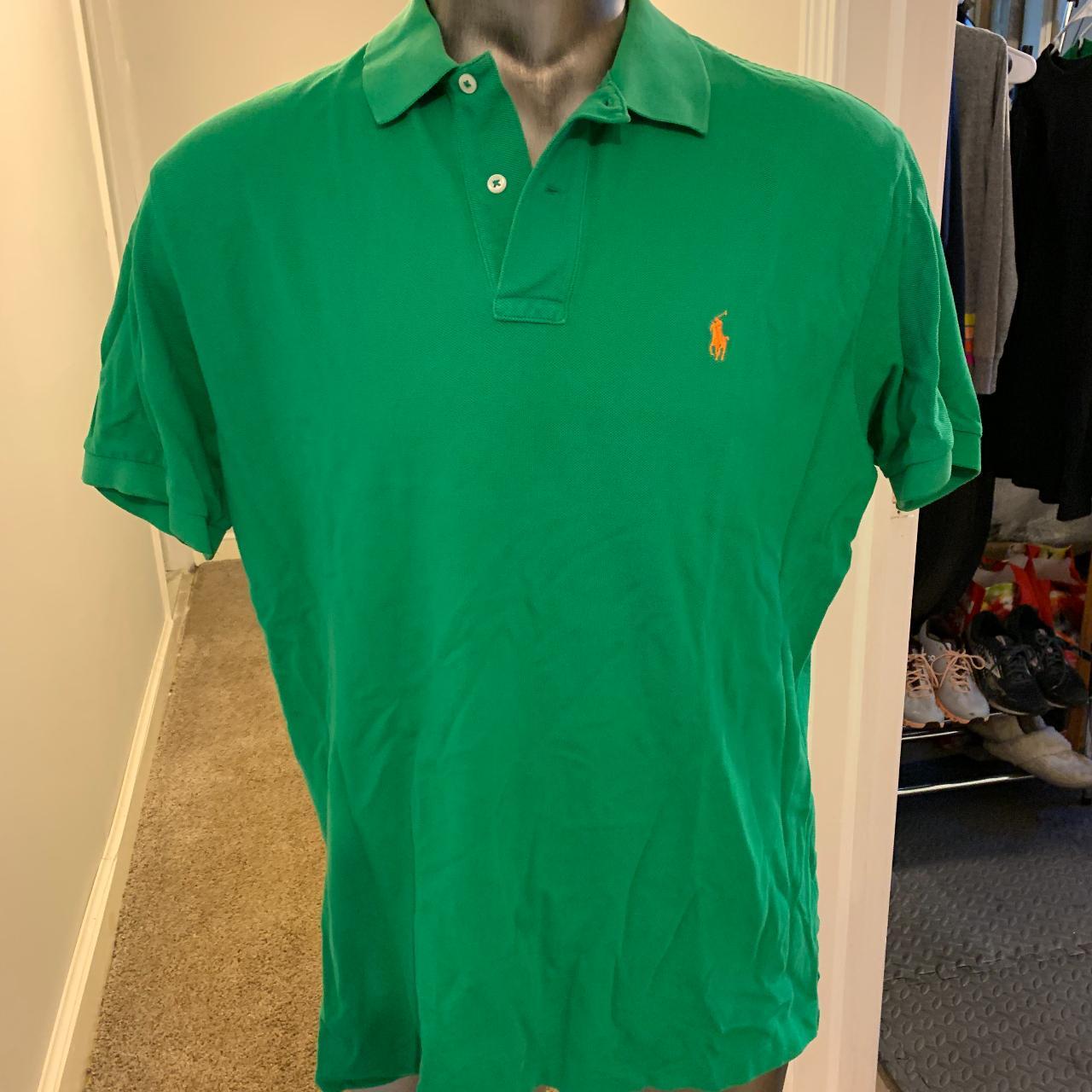 Green polo shirt store with orange horse