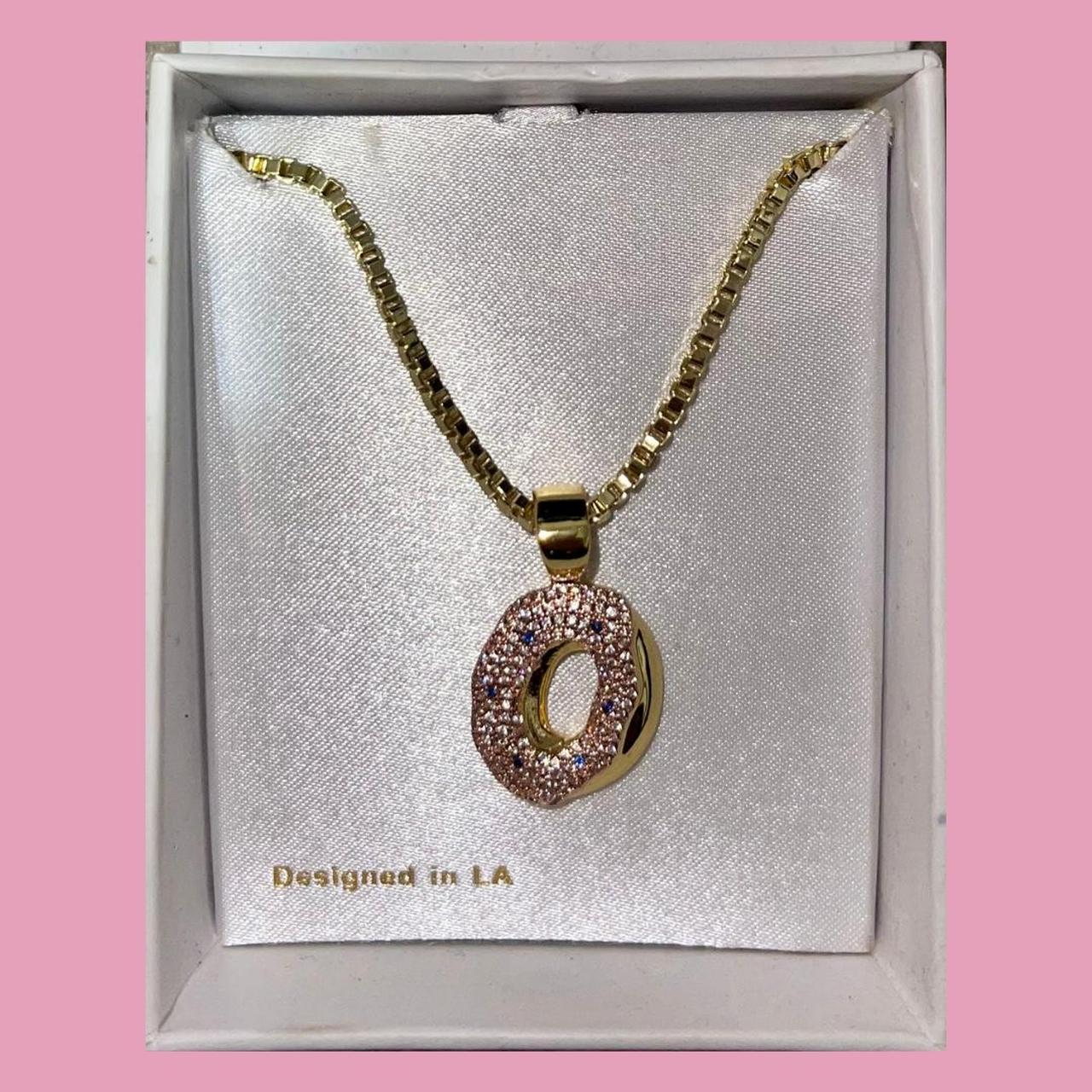 Our #kingice X #OddFuture Donut Necklace utilizes...