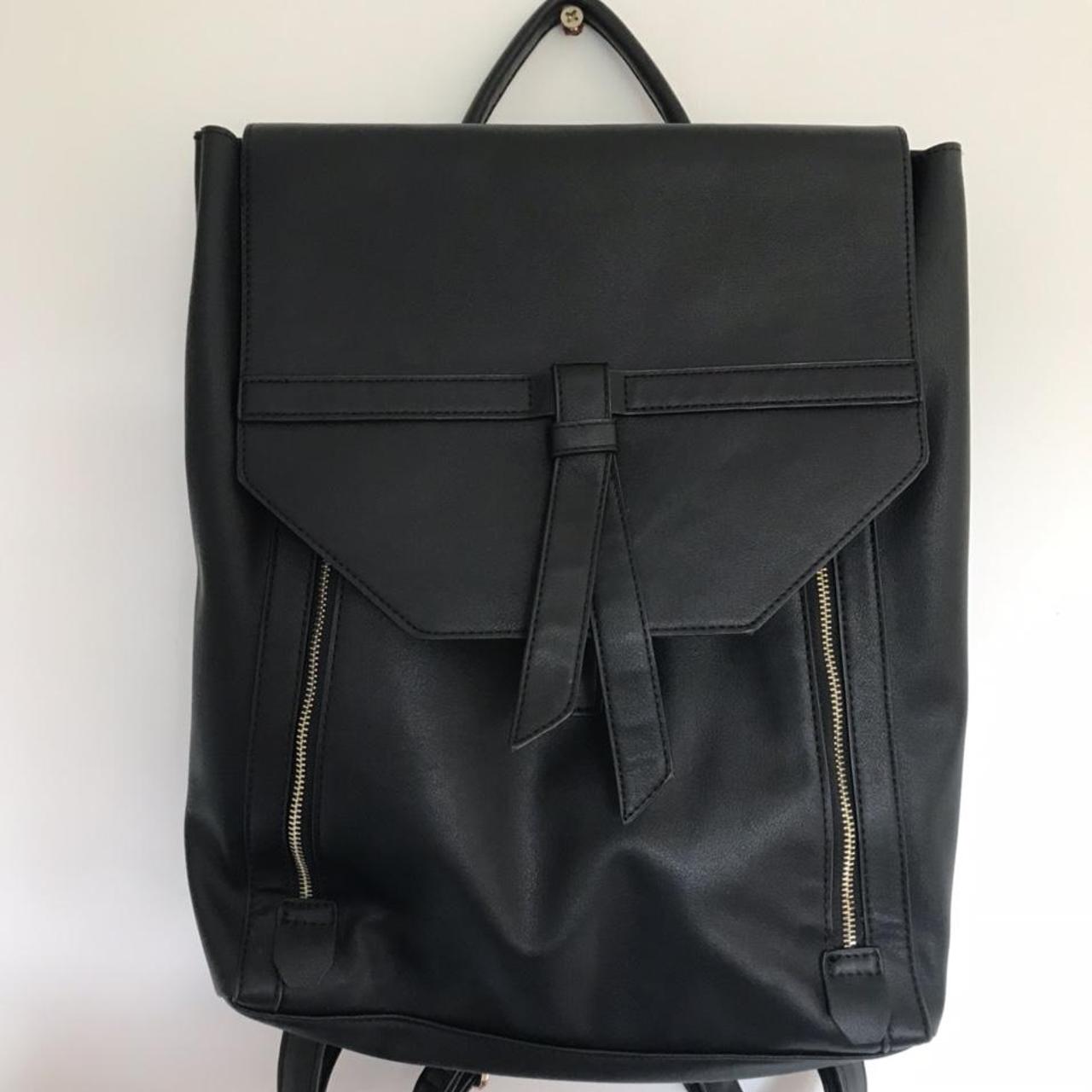 Stylish black backpack with gold zips and buckles -... - Depop