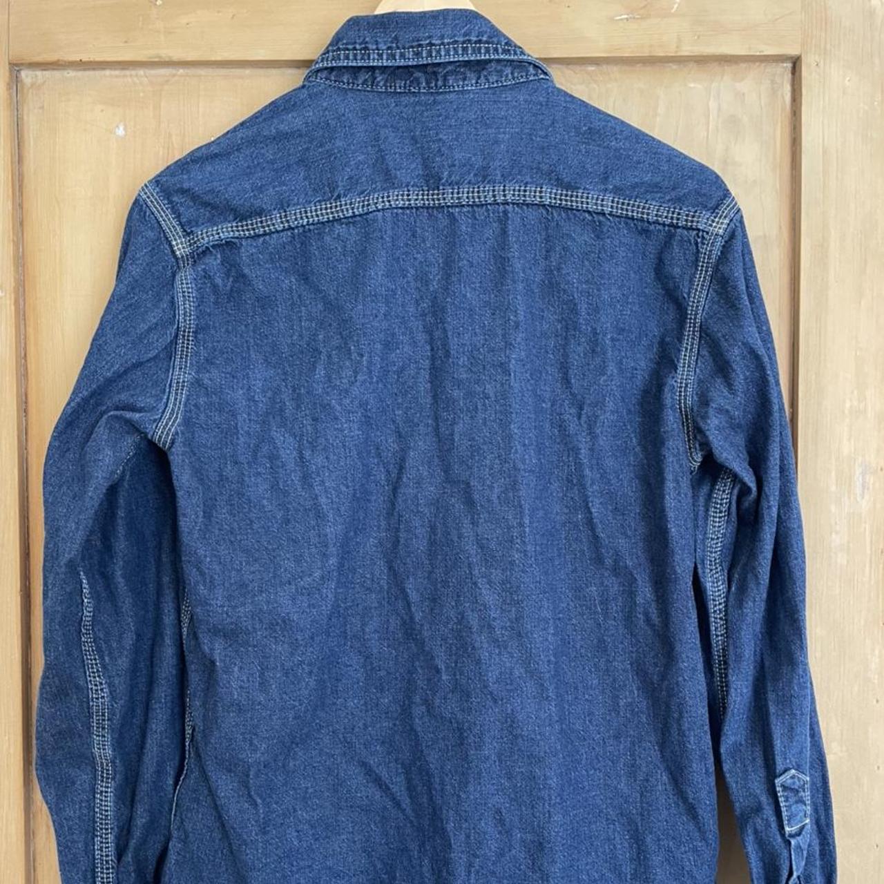 Uniqlo denim work shirt in blue wash, sized XS. Used... - Depop