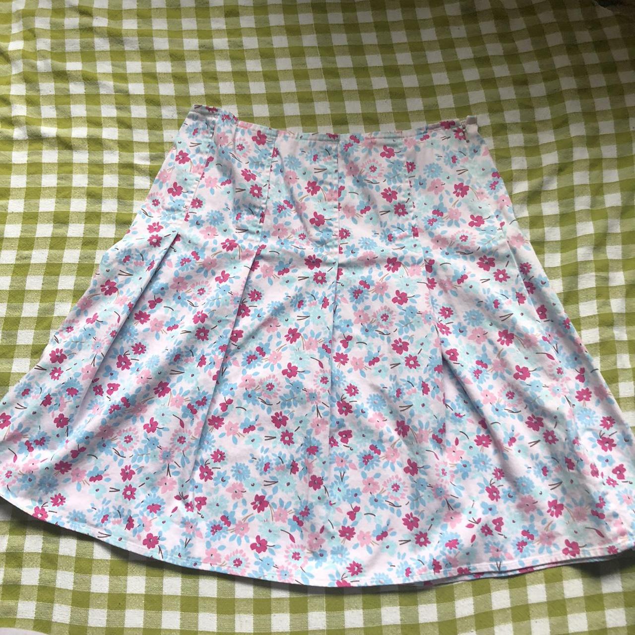 Y2k pleated pink and blue floral skirt. Fits a... - Depop