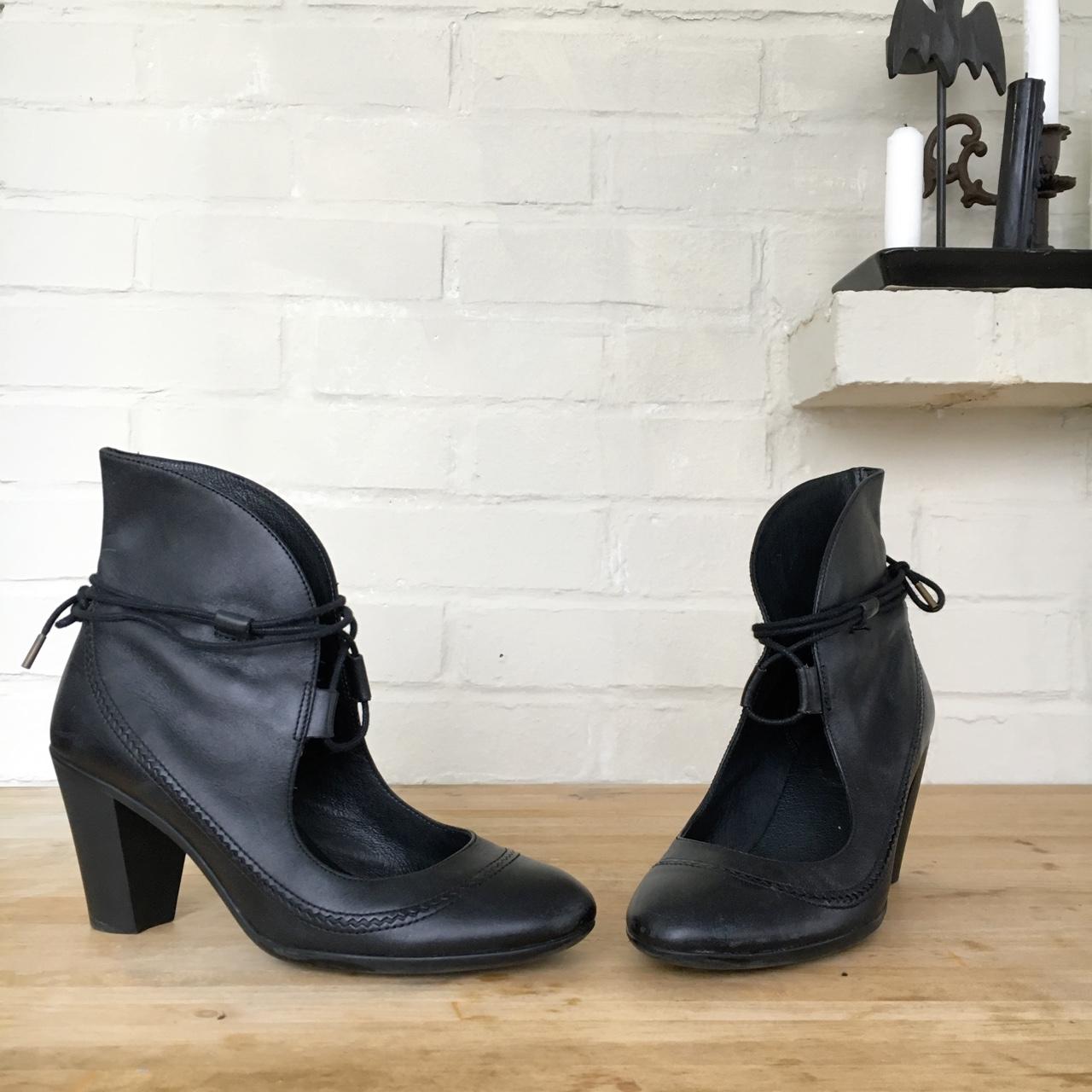 Black leather heeled booties made by Camper, with a... - Depop