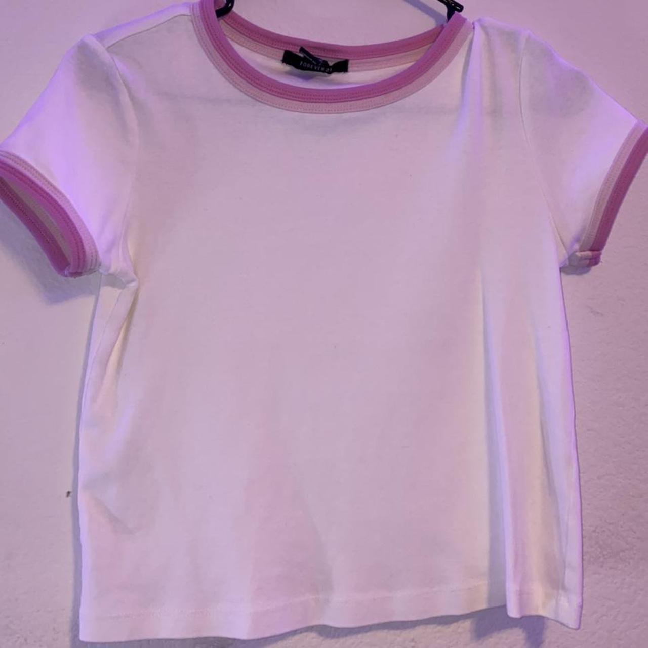 white baby tee with pink details. arms are a bit... - Depop