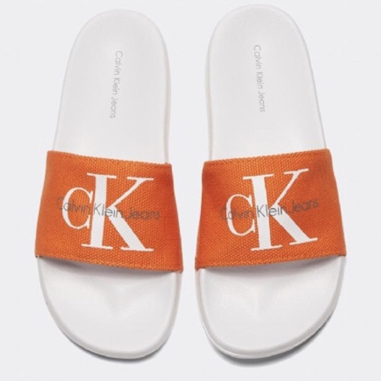 orange calvin klein sliders