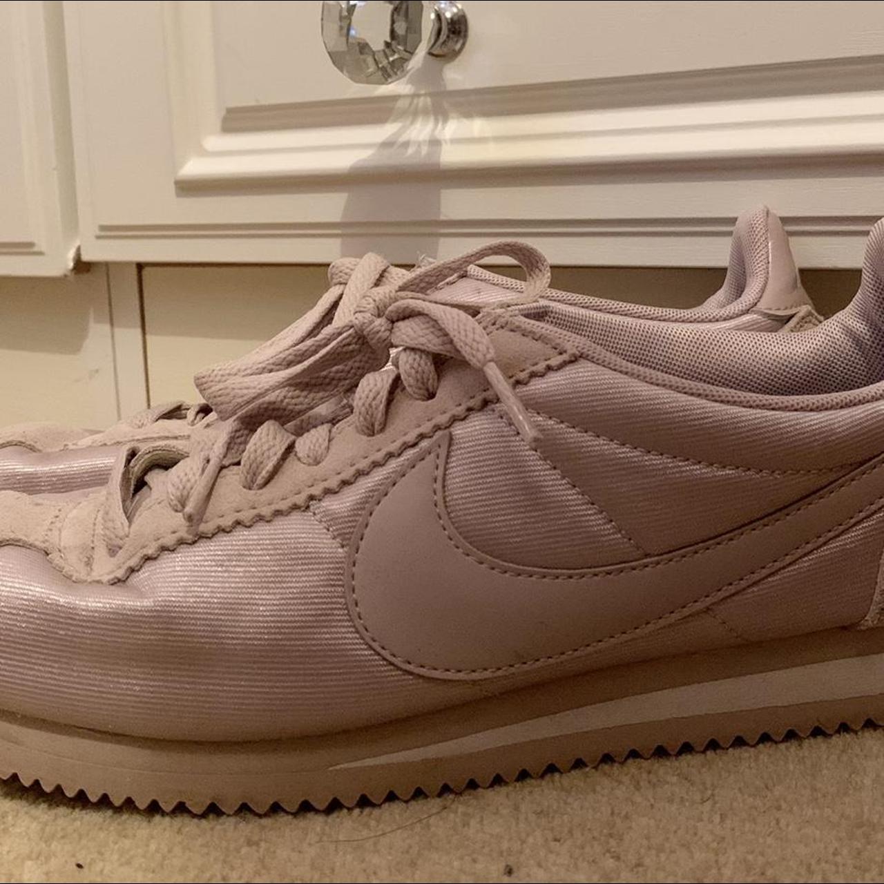 pink nike cortez with gold swoosh