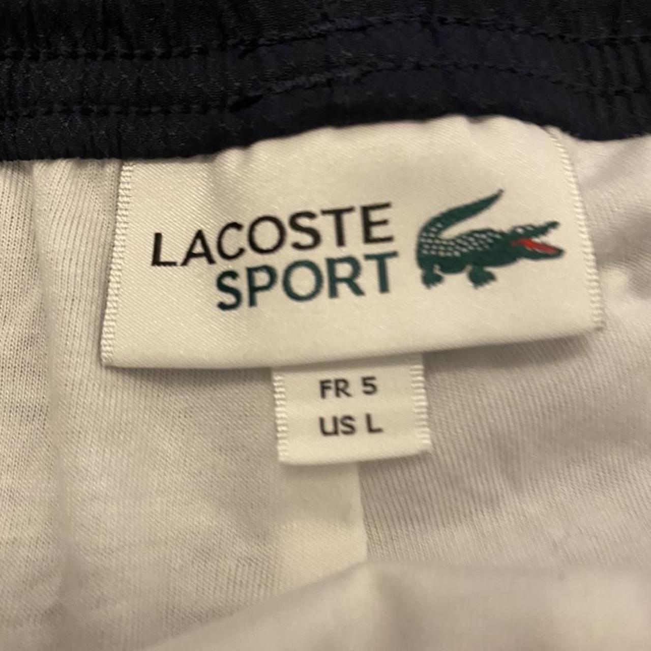 Navy Lacoste guppy brand new with tags and everything - Depop