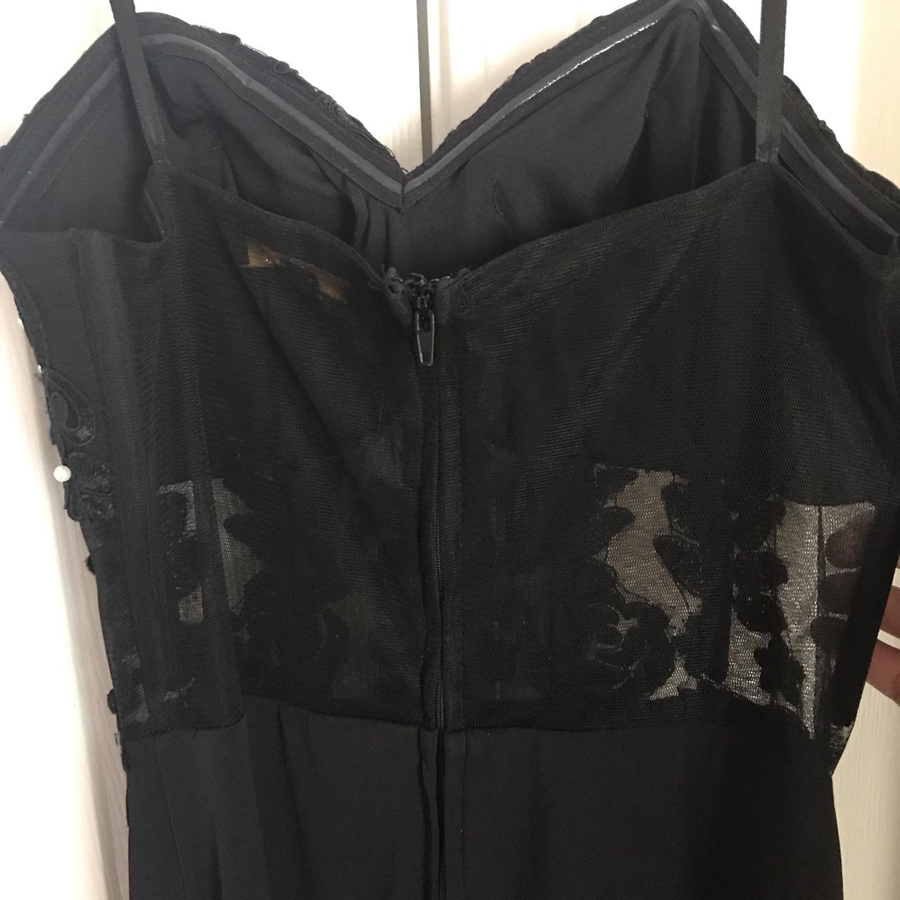 Long, black formal dress. It has a sheer upper back... - Depop