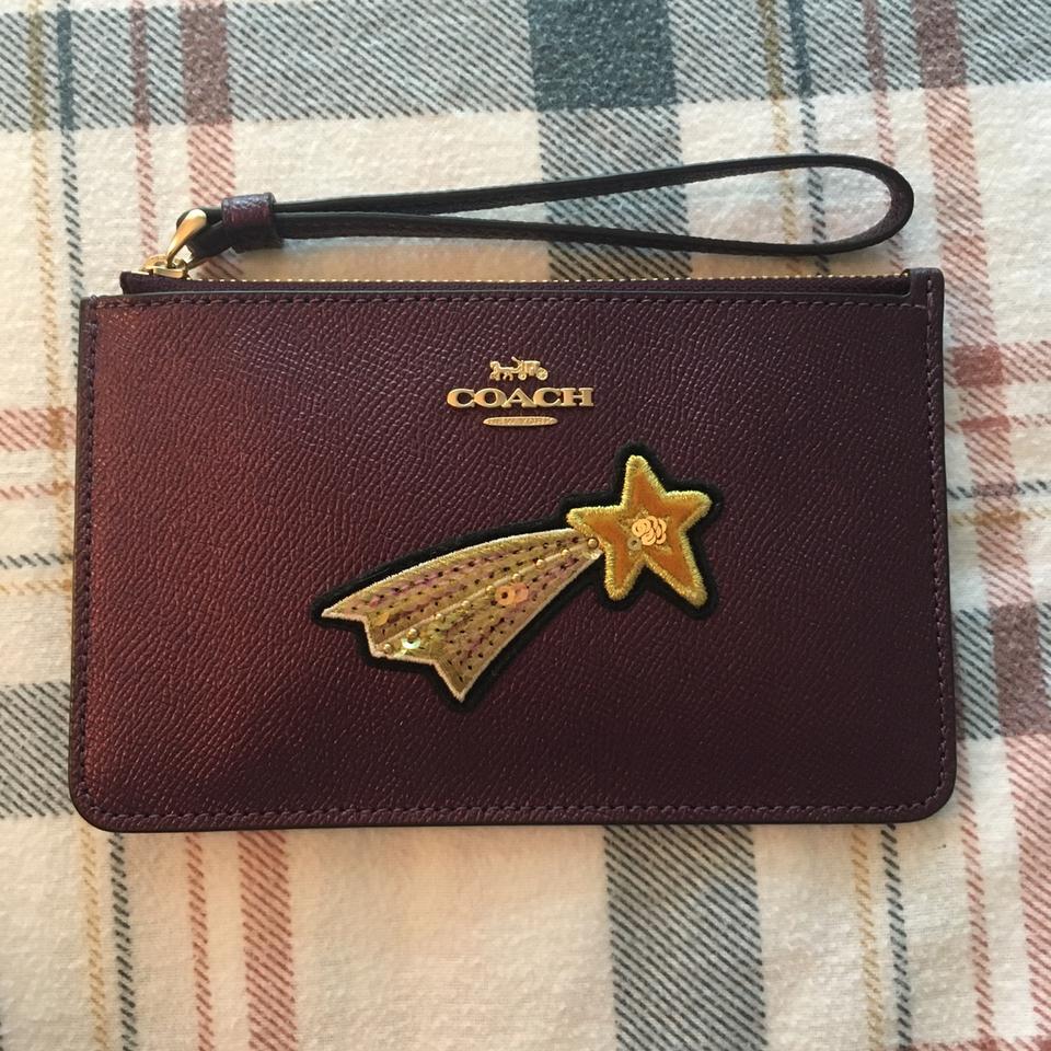 coach gold star wristlet