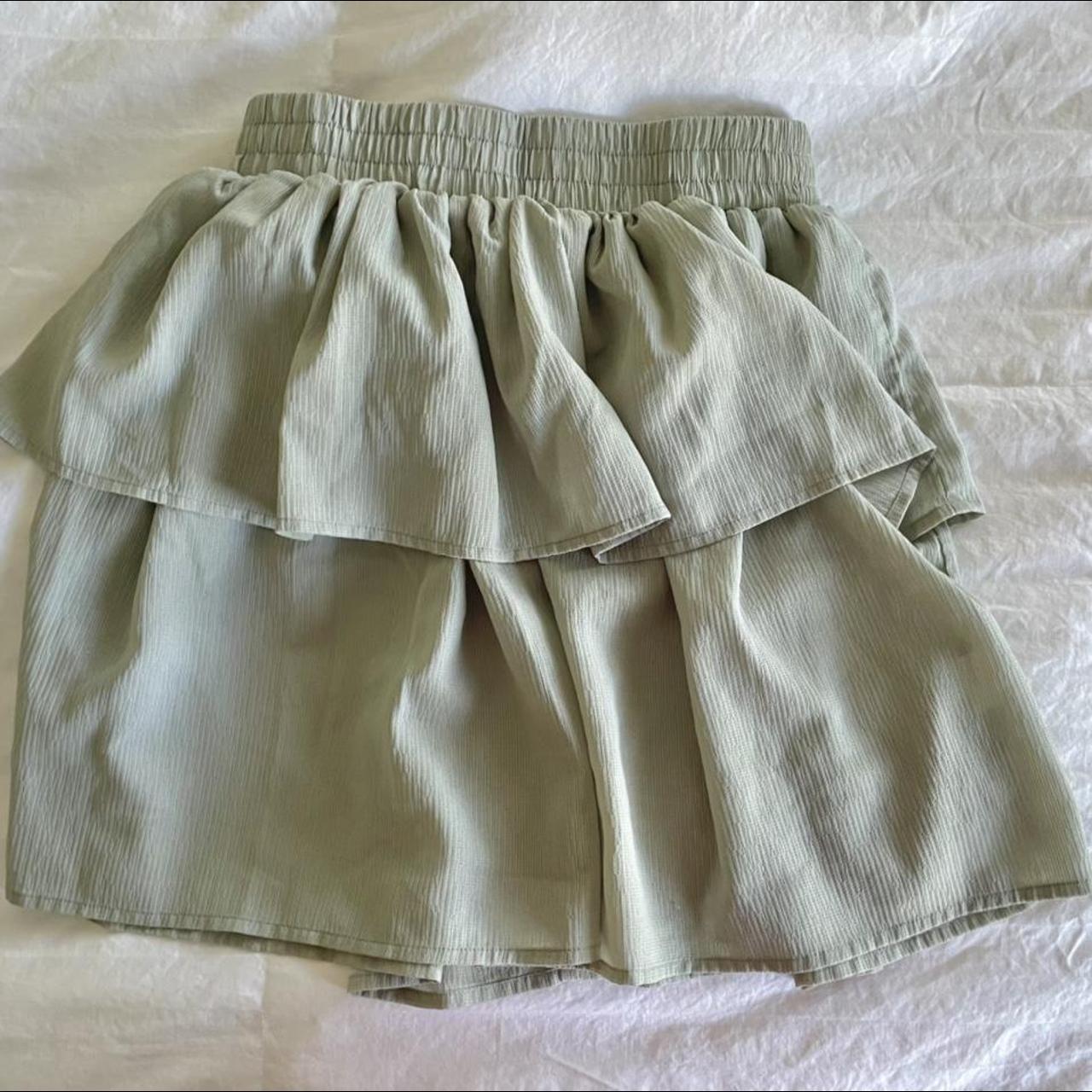 sage green tiered miniskirt - size small but can fit... - Depop