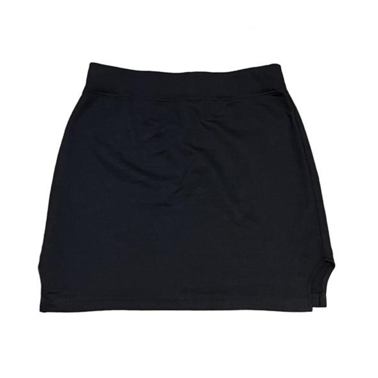 black mini skirt has small slits on the side says... - Depop