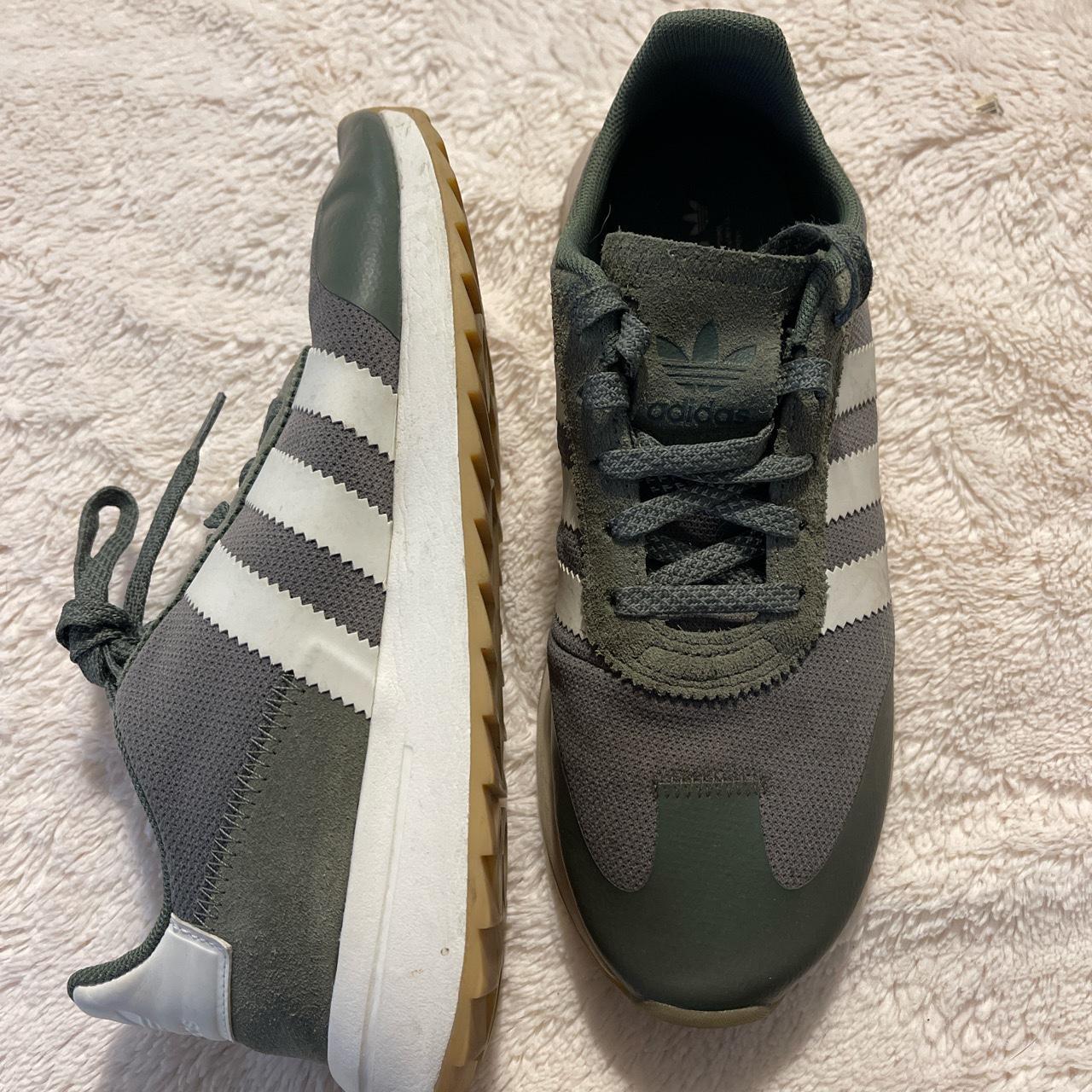 Used Hunter green Adidas. No box buy I can provide