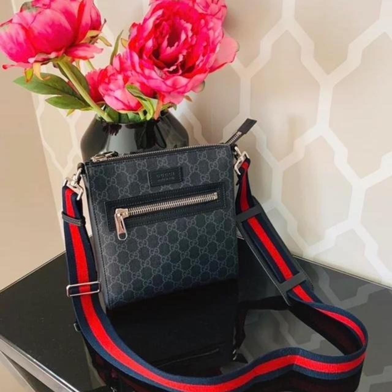 A flat messenger bag made in Gucci's iconic GG... - Depop