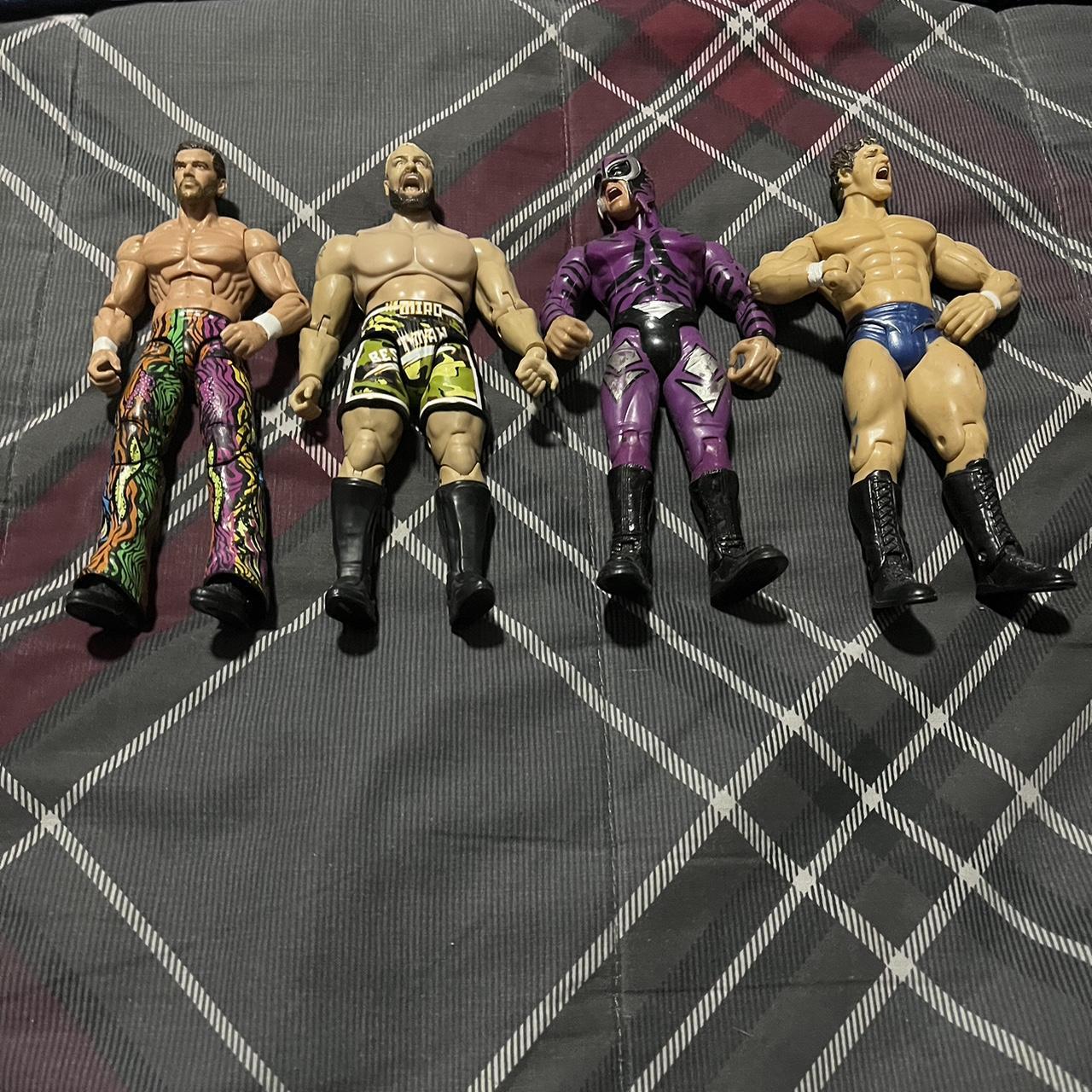 Lot of four WWE action figures Lot of 4 WWE action... Depop