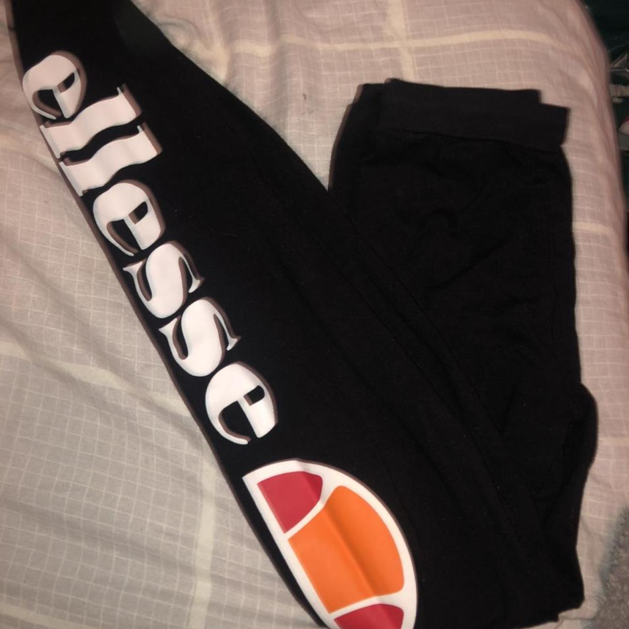 Black ellesse leggings with detailing down the side. - Depop