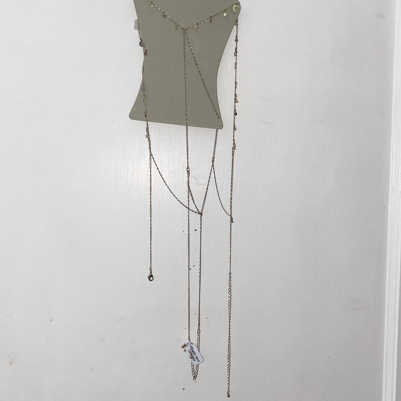 Urban Outfitter Celestial Body Chain in gold — never... Depop