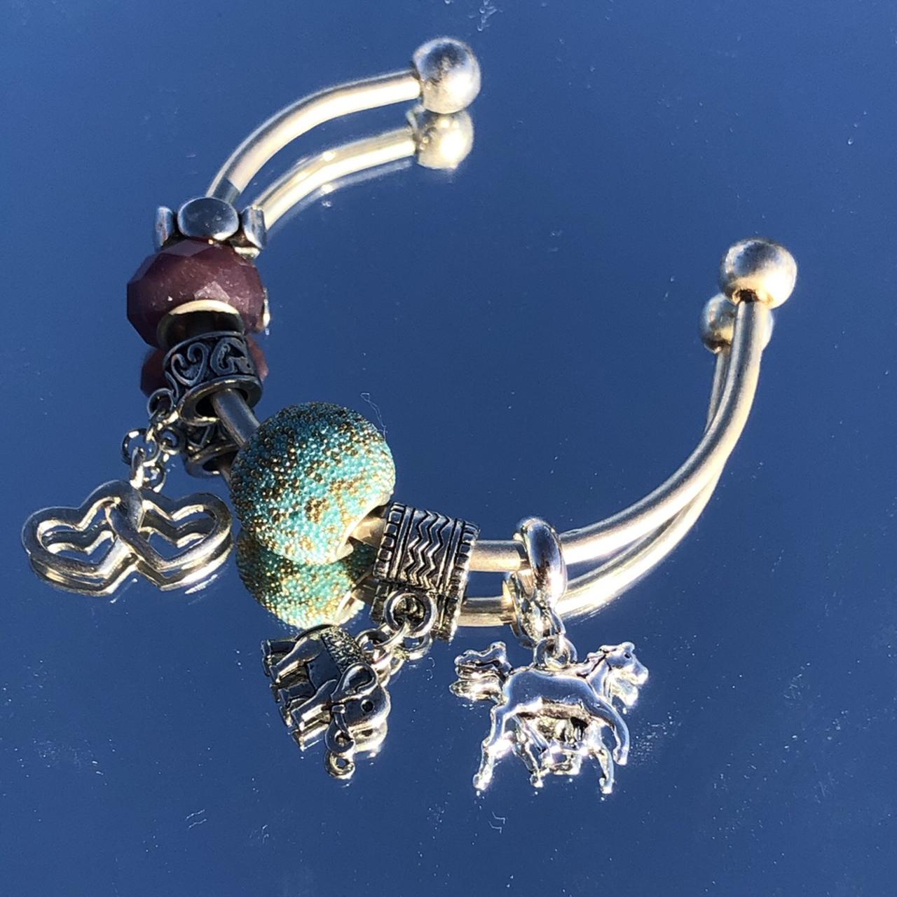 Silver charm bracelet! A bangle with all the luck in... Depop
