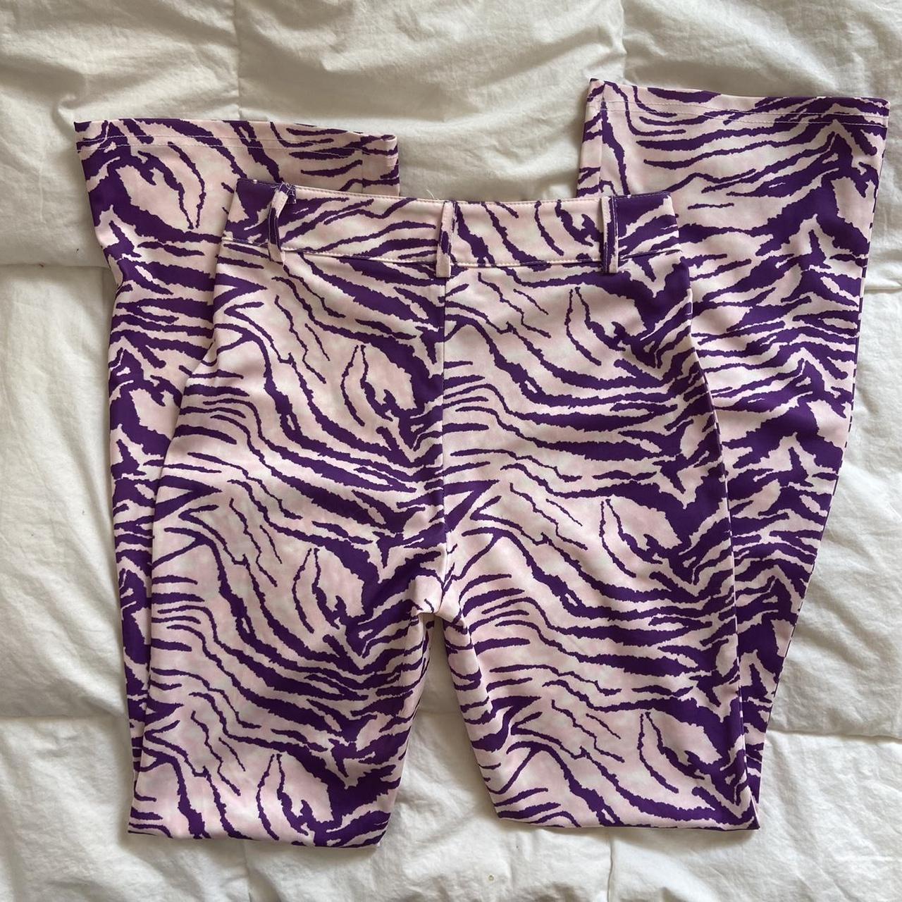 purple zebra flare pants, super cute on and fit... Depop