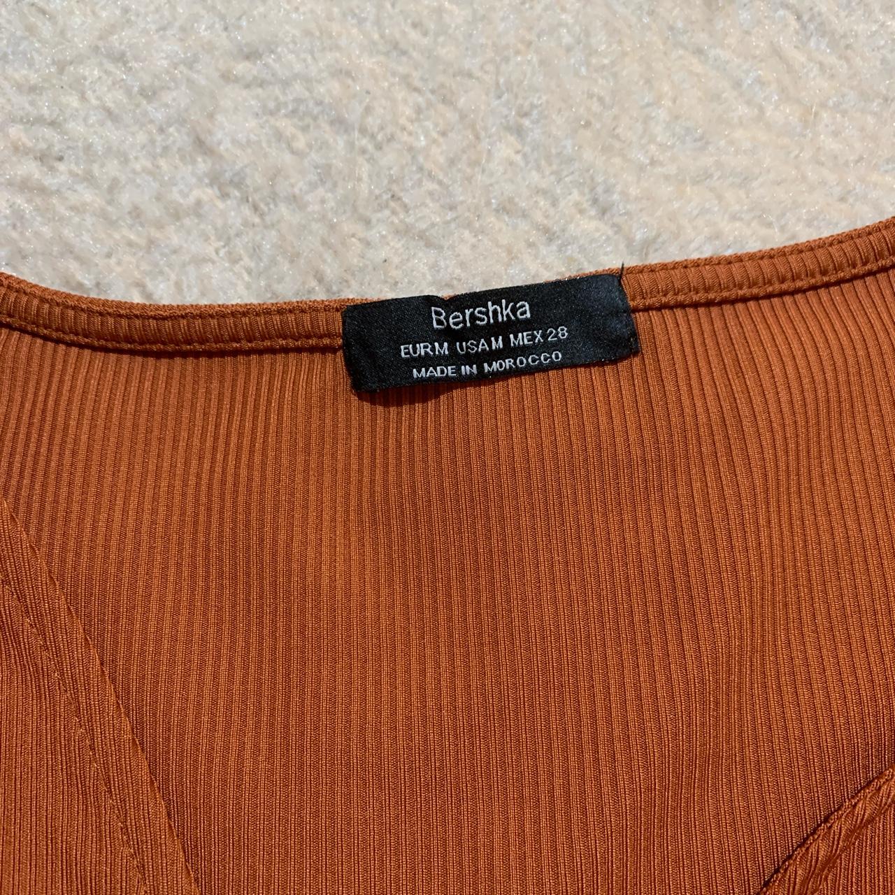 bershka O ring cord short sleeve crop top in a rust... - Depop