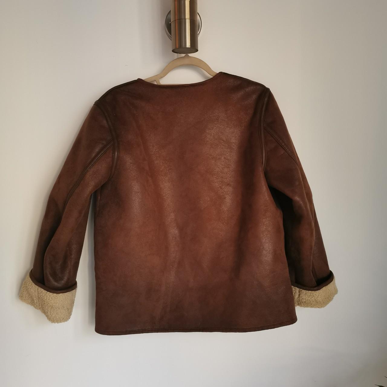 Brown shearling jacket. I cut out the label so... Depop