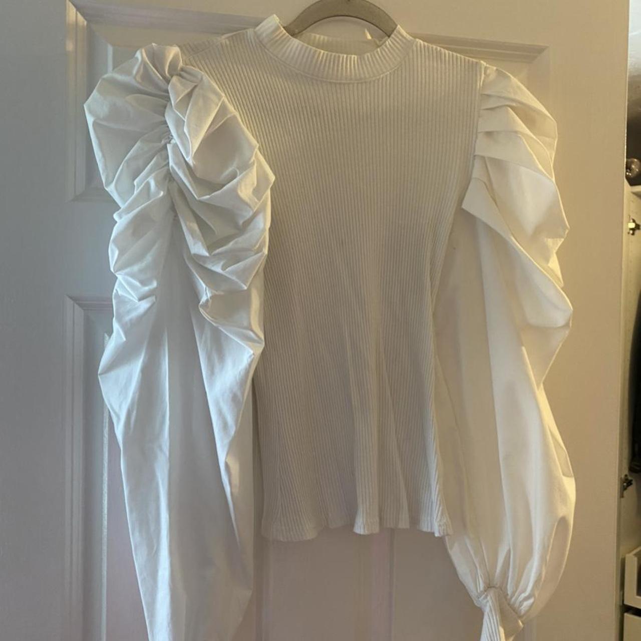 white top with puffy shoulders & arms runs very small - Depop