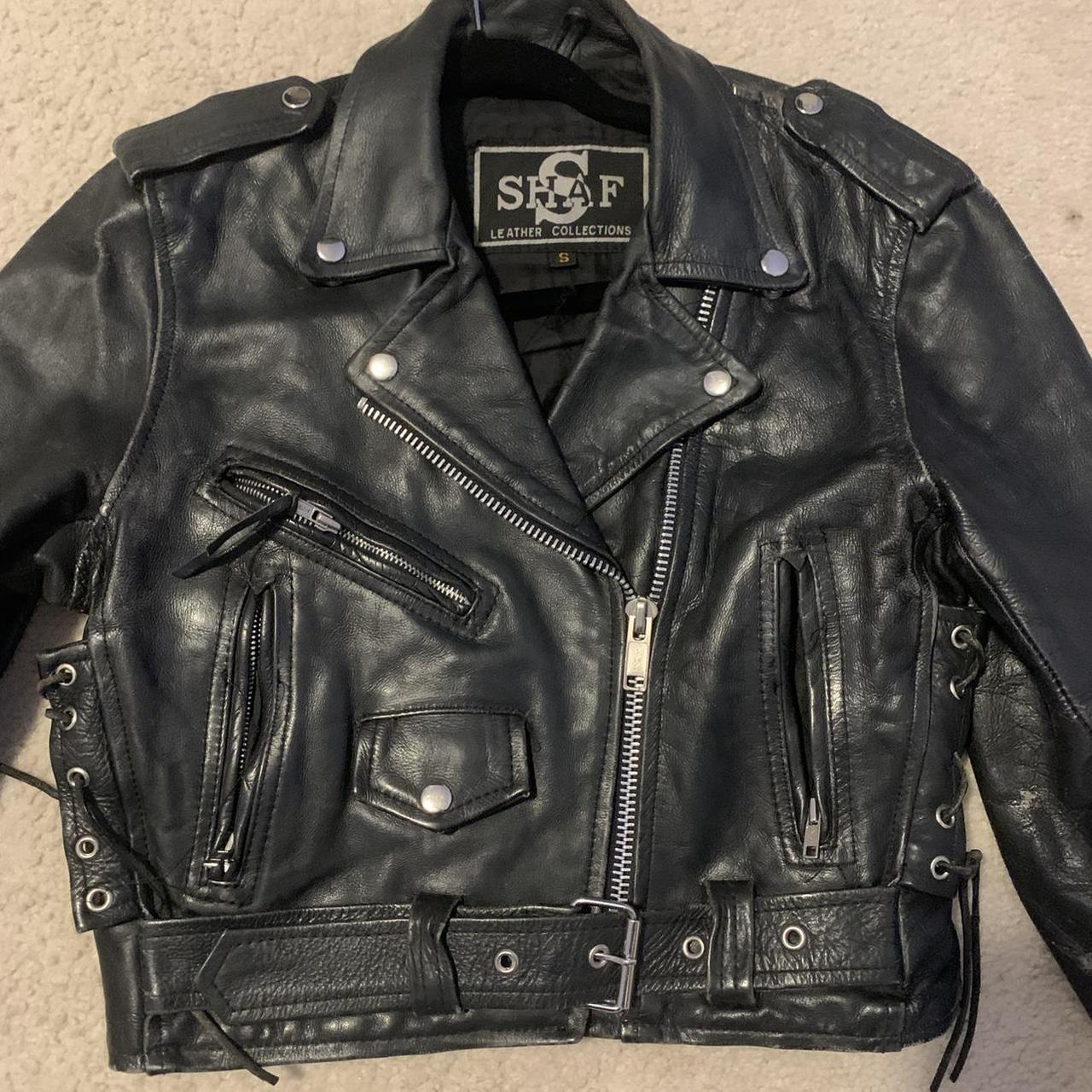 Vintage black leather biker jacket with side ties.... - Depop