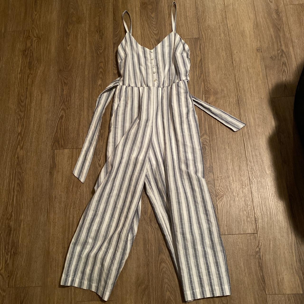 Really cute romper that has a tie and adjustable... - Depop