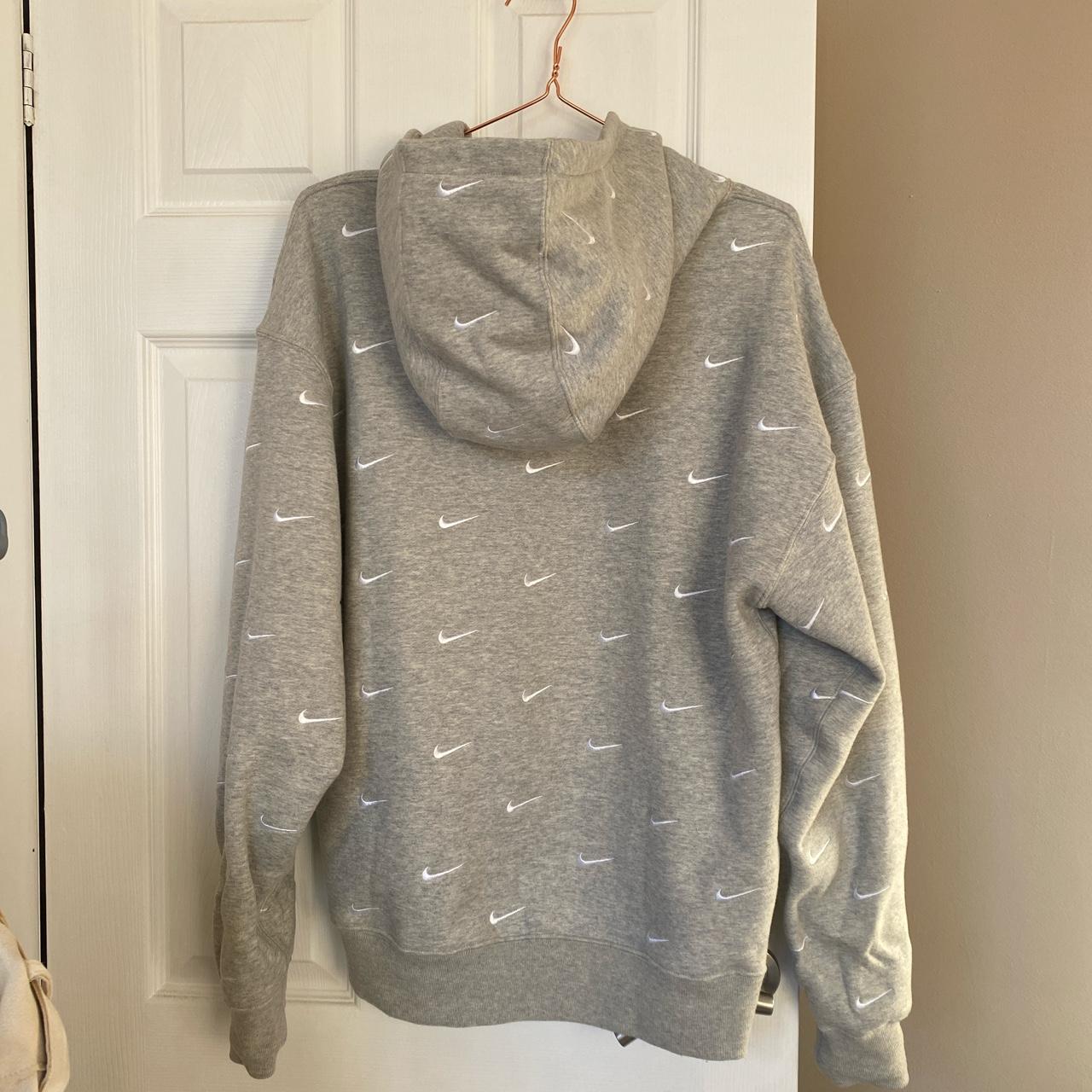 Nike all over swoosh logo hoodie Would anyone be Depop