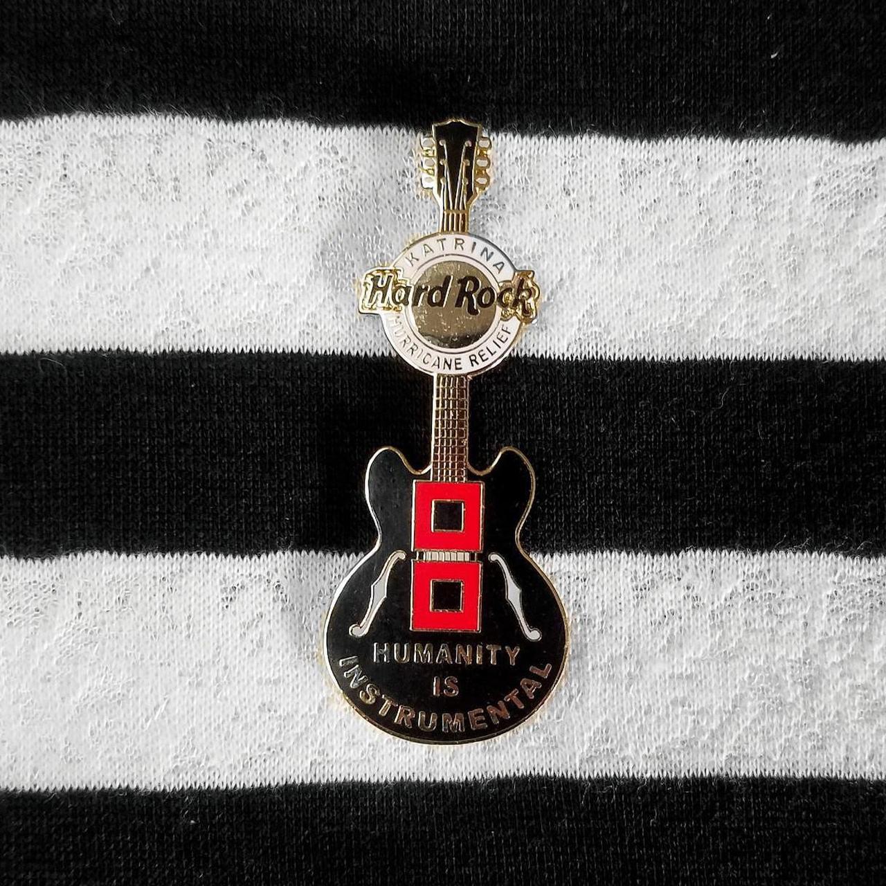 Hard Rock Cafe pin Hurricane Katrina Relief Guitar Humanity is Instrumental logo 