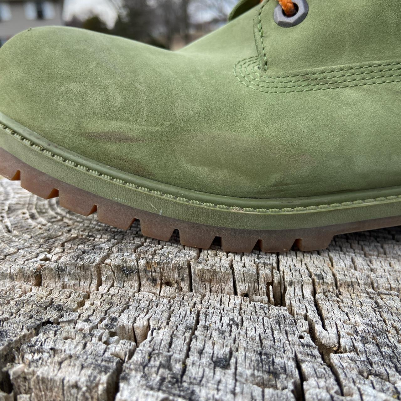 green timbs with orange laces