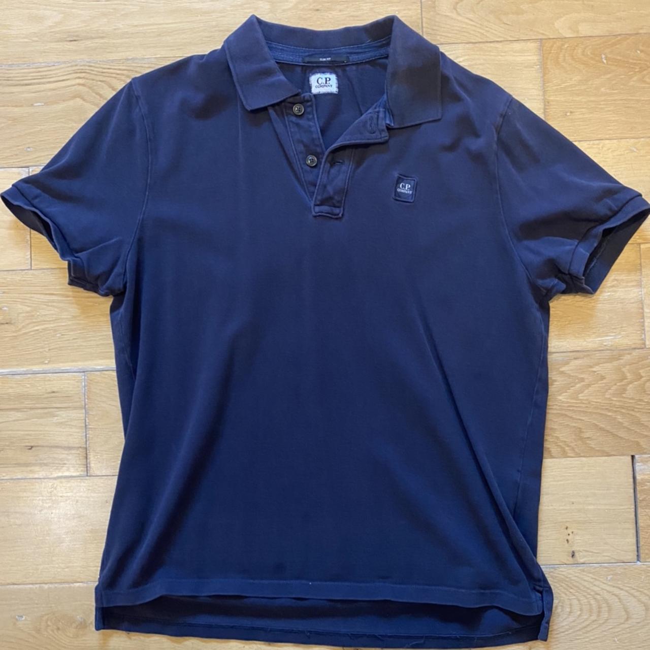 CP company polo Navy Size xl , more like a L/M - Depop