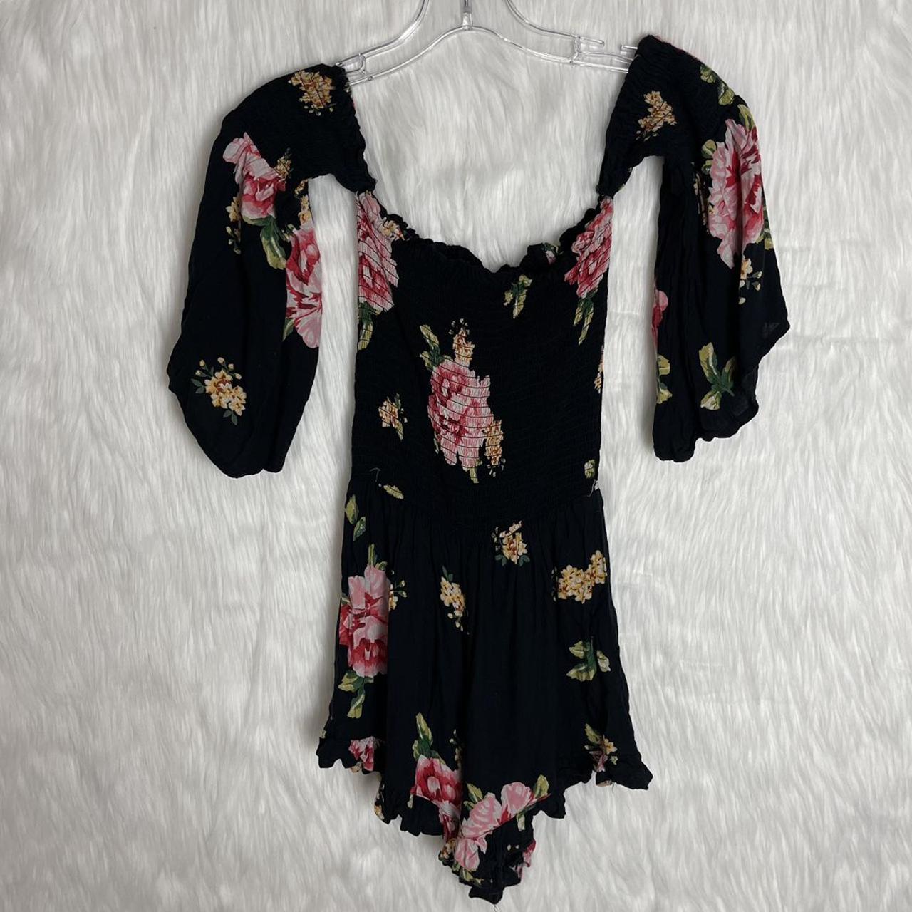 black romper with pink flowers