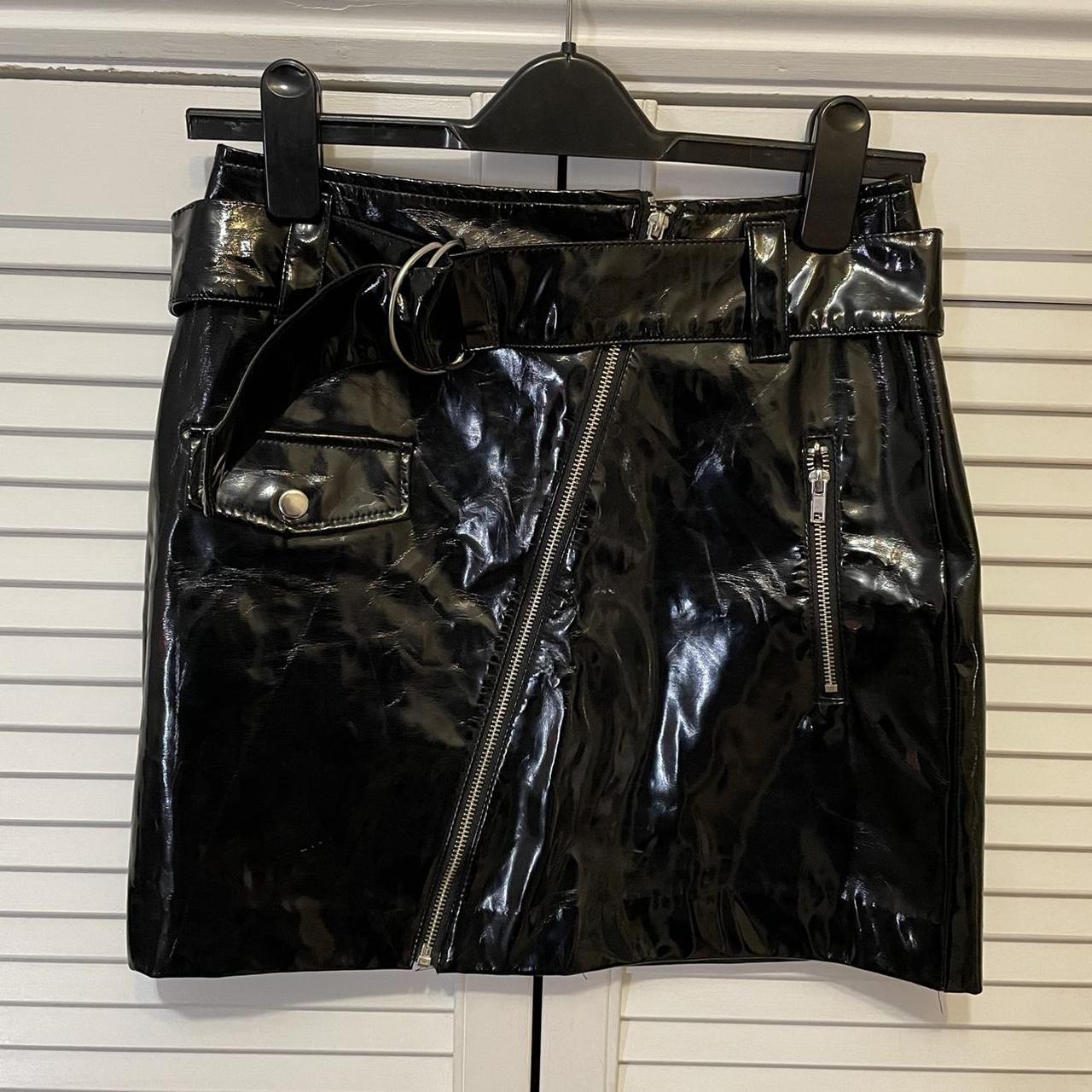 H&M vinyl skirt. Size 8. Worn but still great... Depop