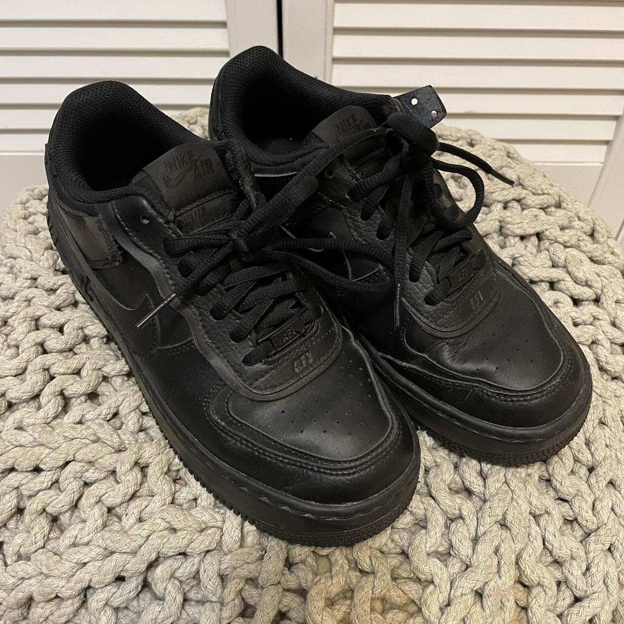 Black Nike Air Force. Size 5. Worn but still great... - Depop