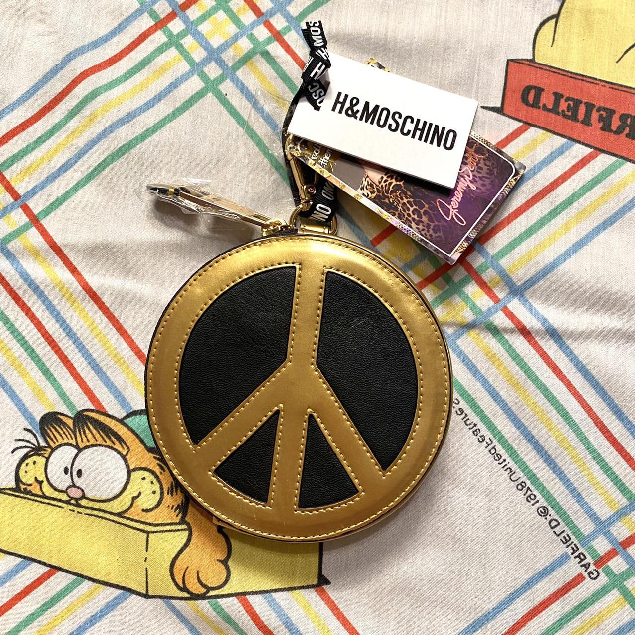 adorable mini peace moschino x h m bag. big zipper