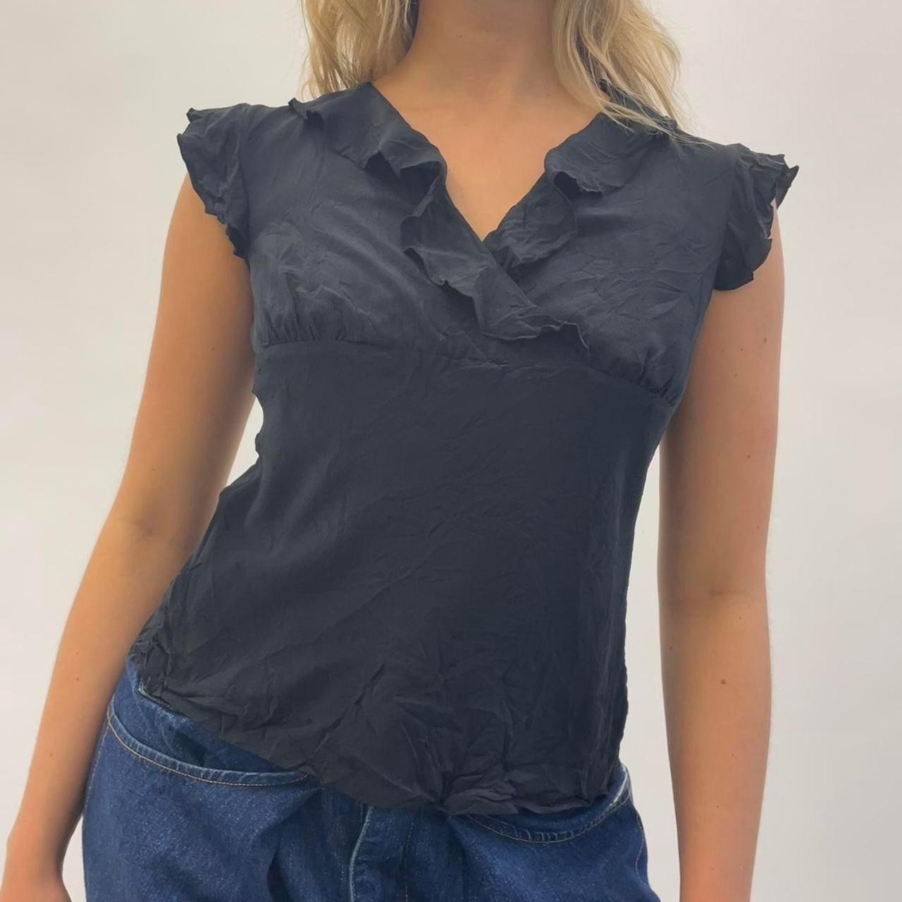 Black ruffle blouse. Wrap cross over at the bust... - Depop