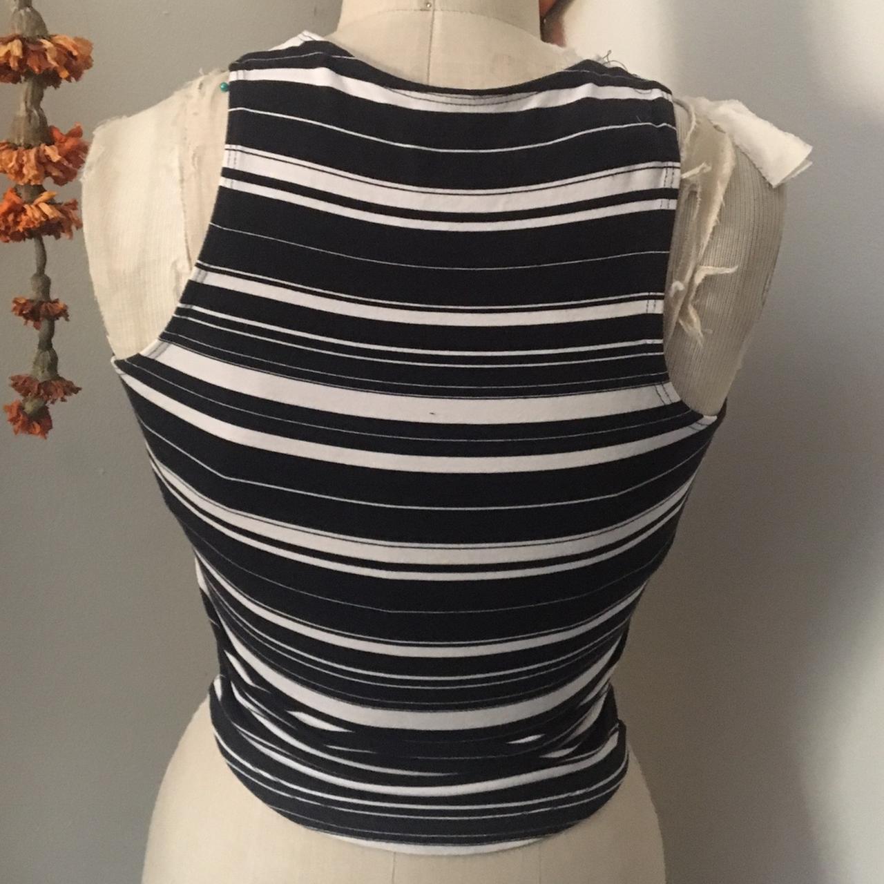 Striped black and white tank. Stretchy but probably... - Depop