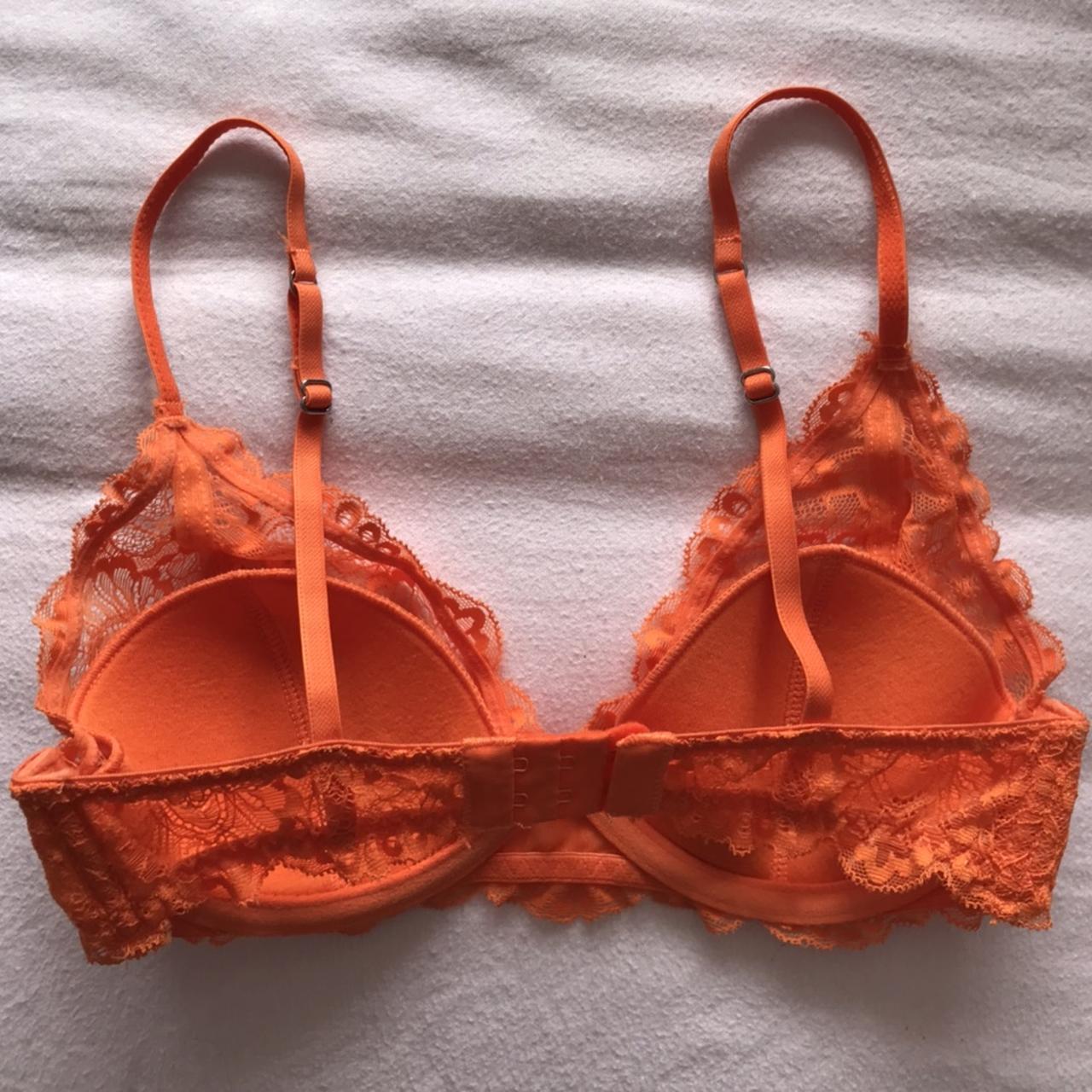 the cutest neon orange lace underwired bra padded