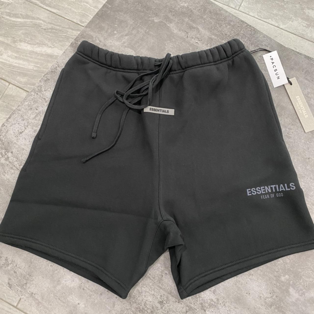 Fear of God Essentials black shorts in size Medium.... - Depop