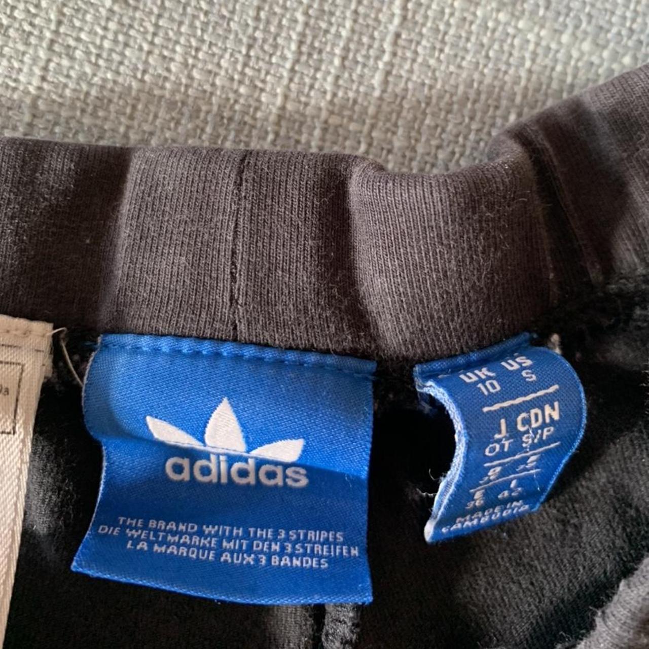 Adidas black cotton leggings with three white... Depop