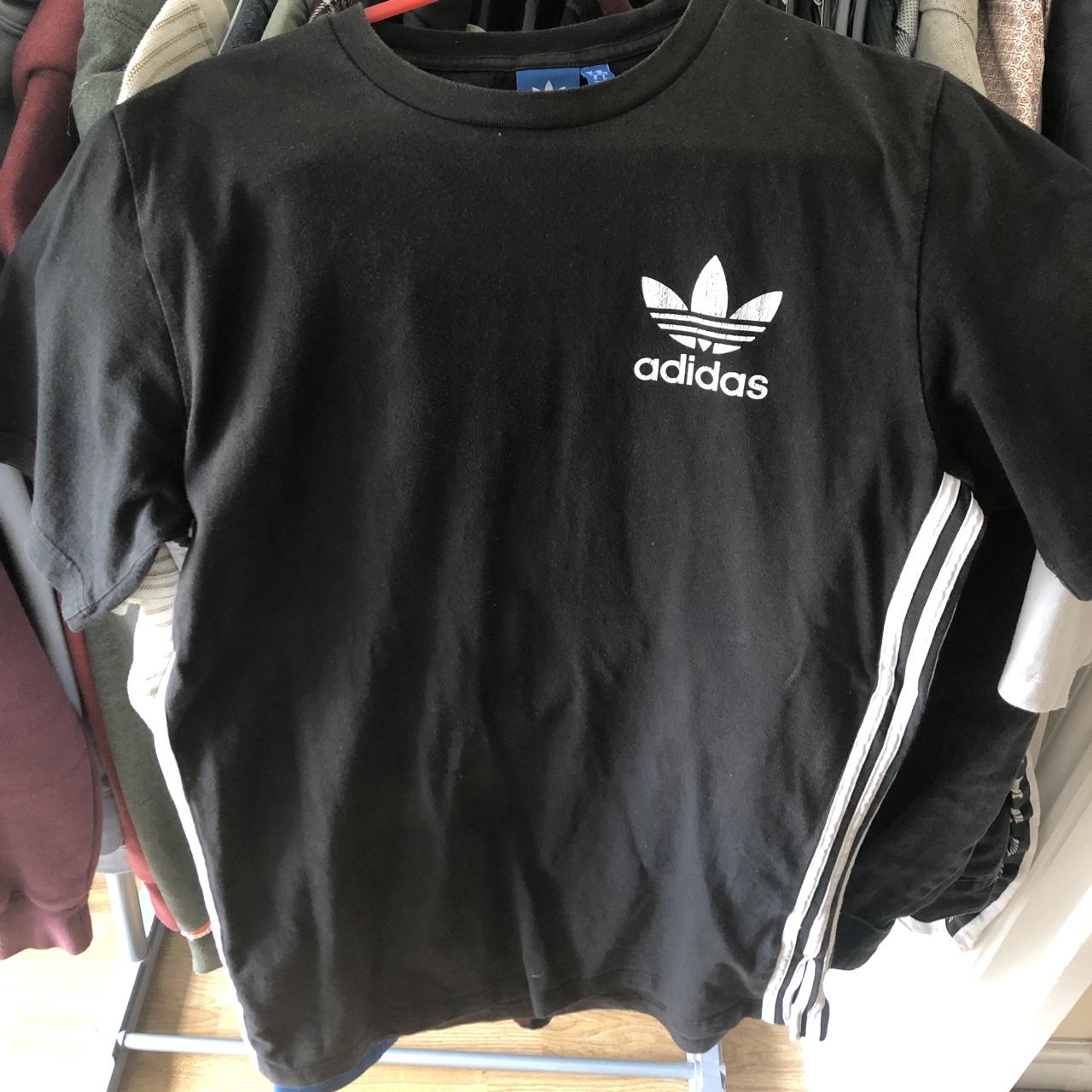 Black Adidas t-shirt with stripes down the side. Had... - Depop