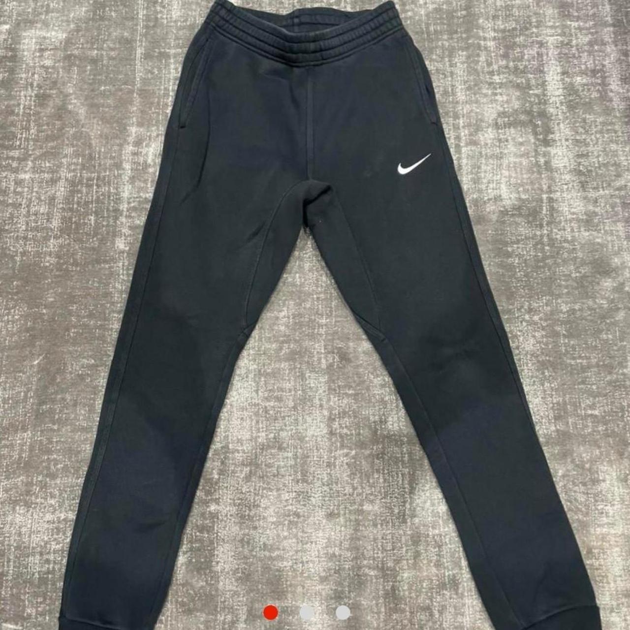 nike swoosh cuffed joggers in black