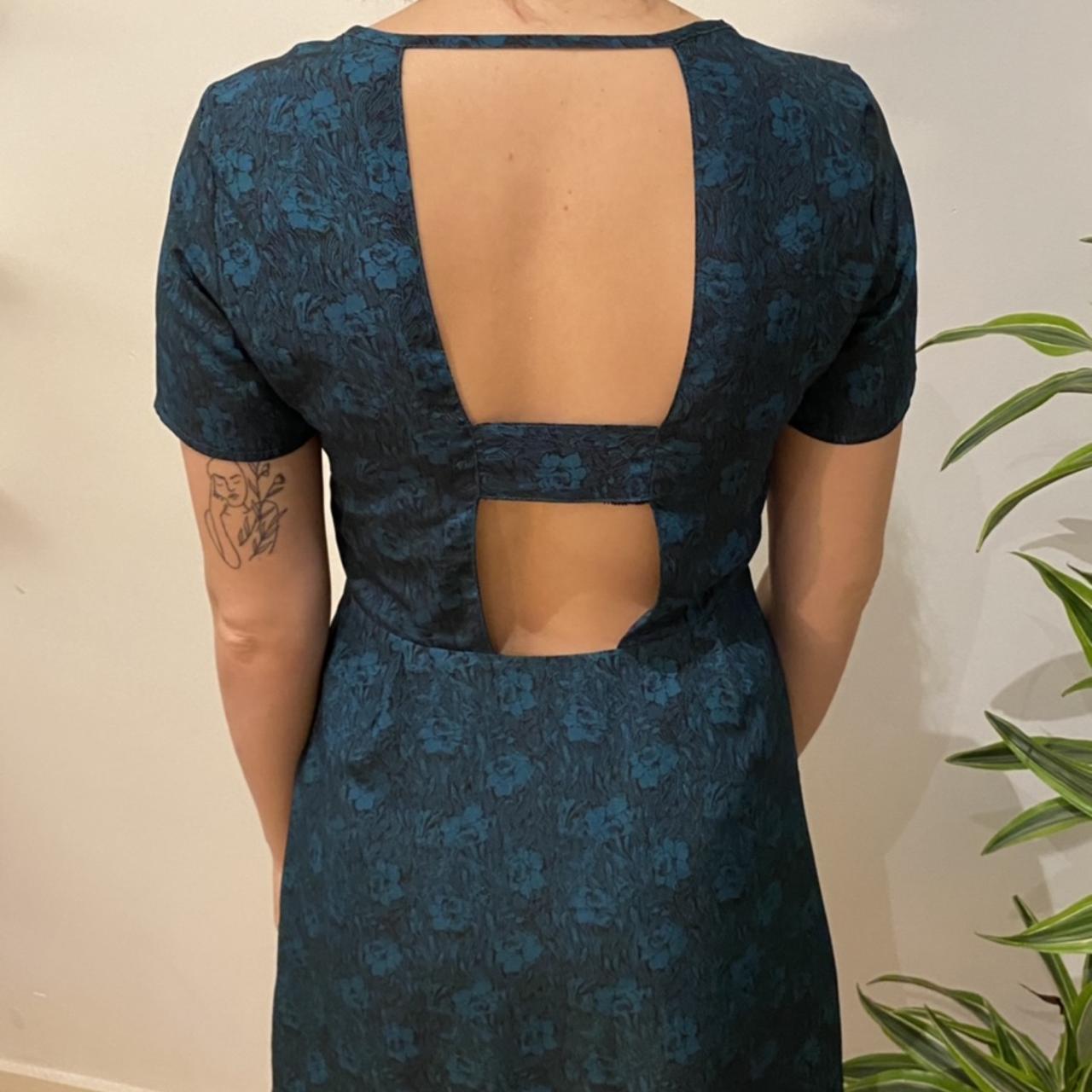 Very cute floral silky dress with cut out back... Depop