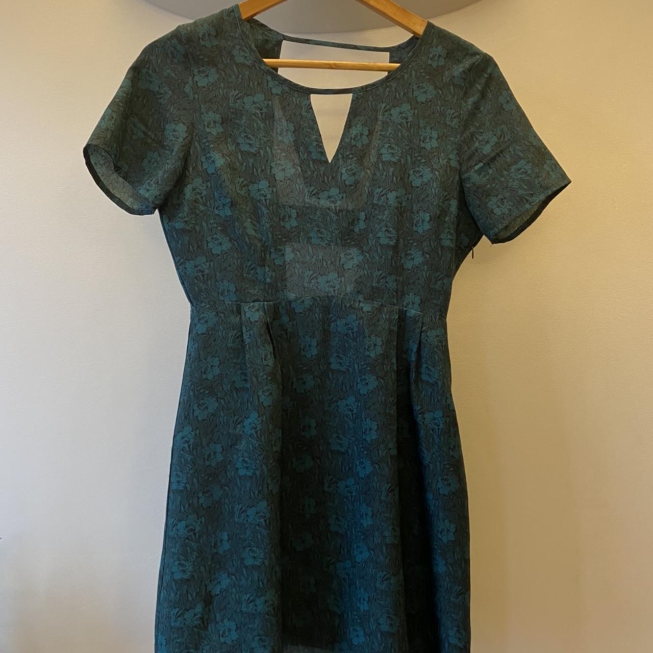 Very cute floral silky dress with cut out back... Depop