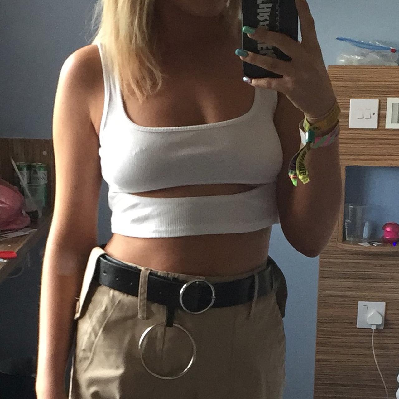 White crop top with slit showing some underboob from