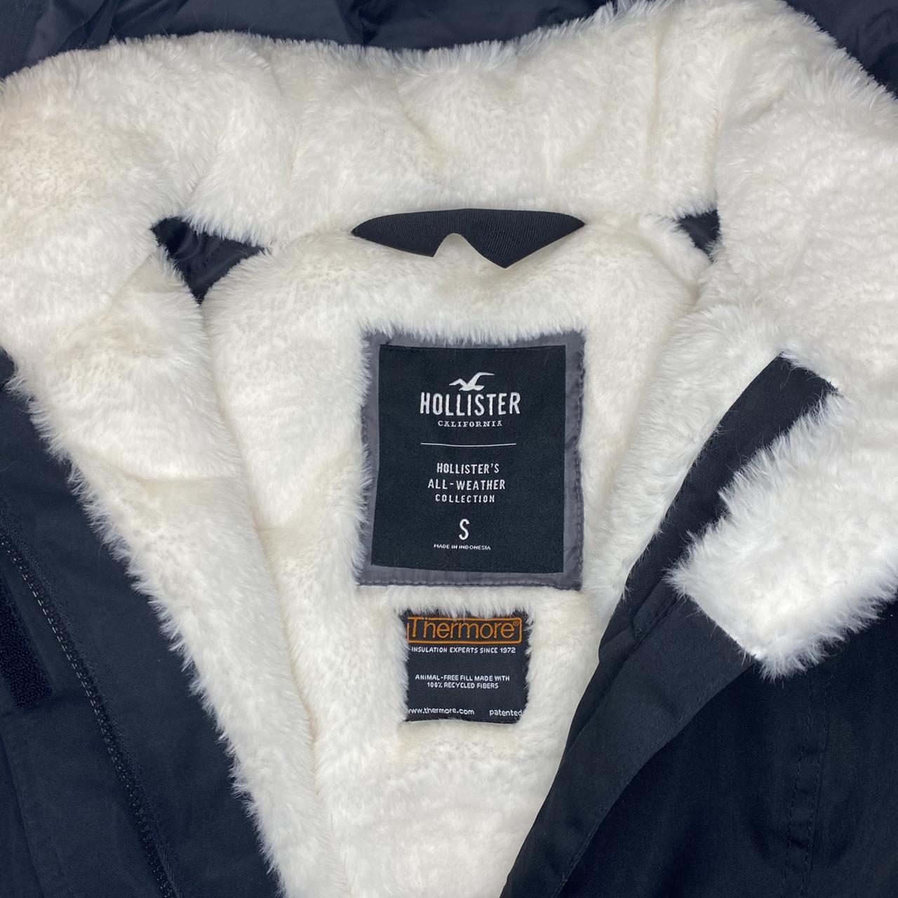 Black Hollister waterproof parka with fauxfur... Depop
