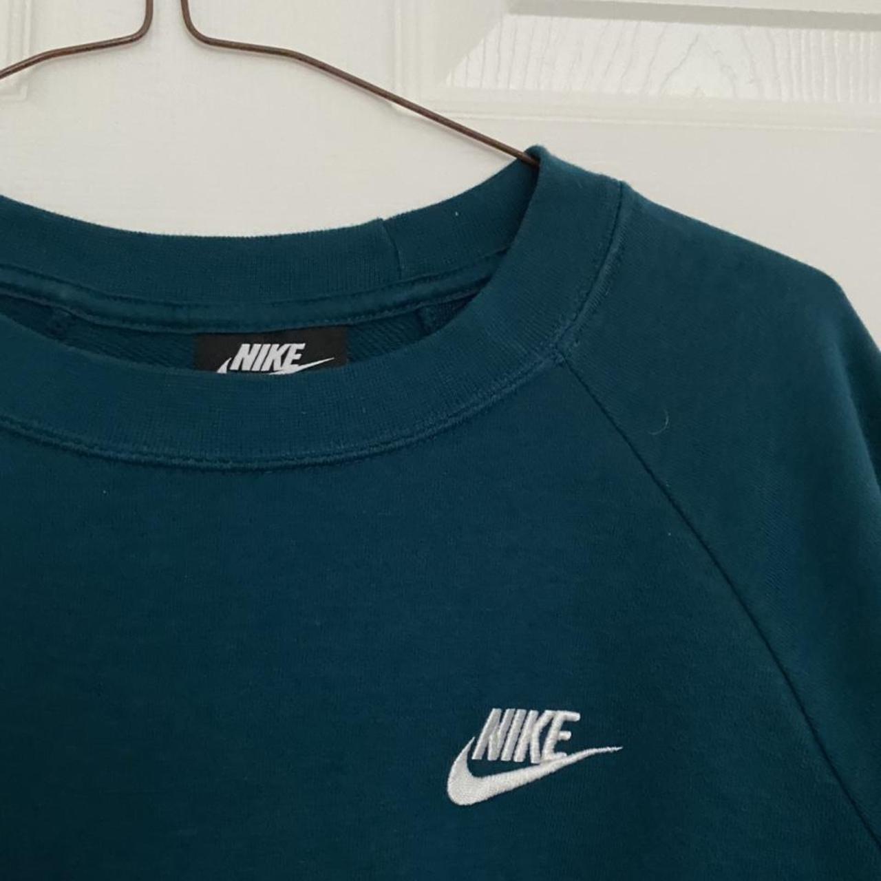 size L teal nike jumper, not too thick but still... - Depop